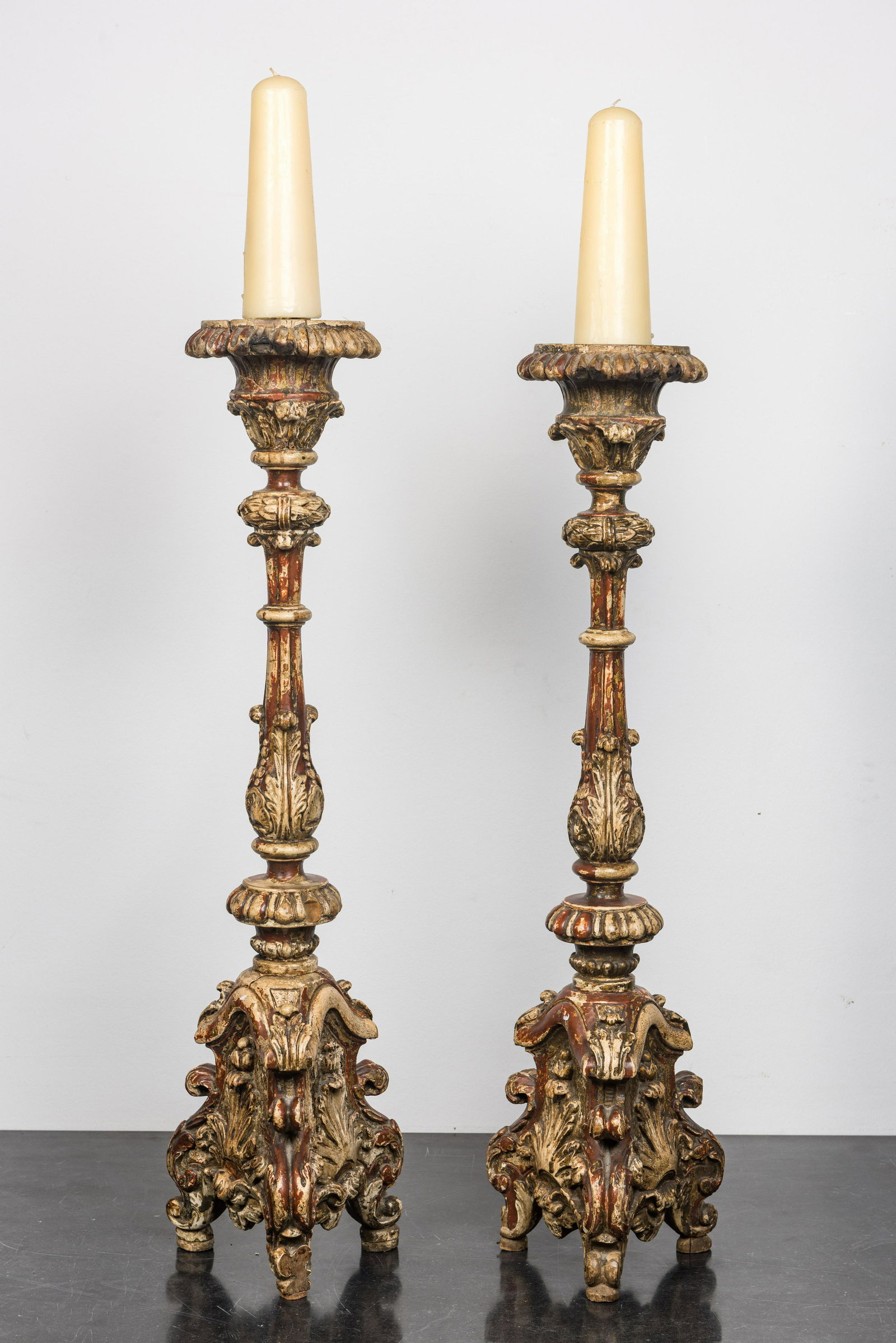 A pair of large painted wooden candlesticks, probably Italy, 18th C.: Full title: A pair of large painted wooden candlesticks, probably Italy, 18th C. Description: H 103 cm