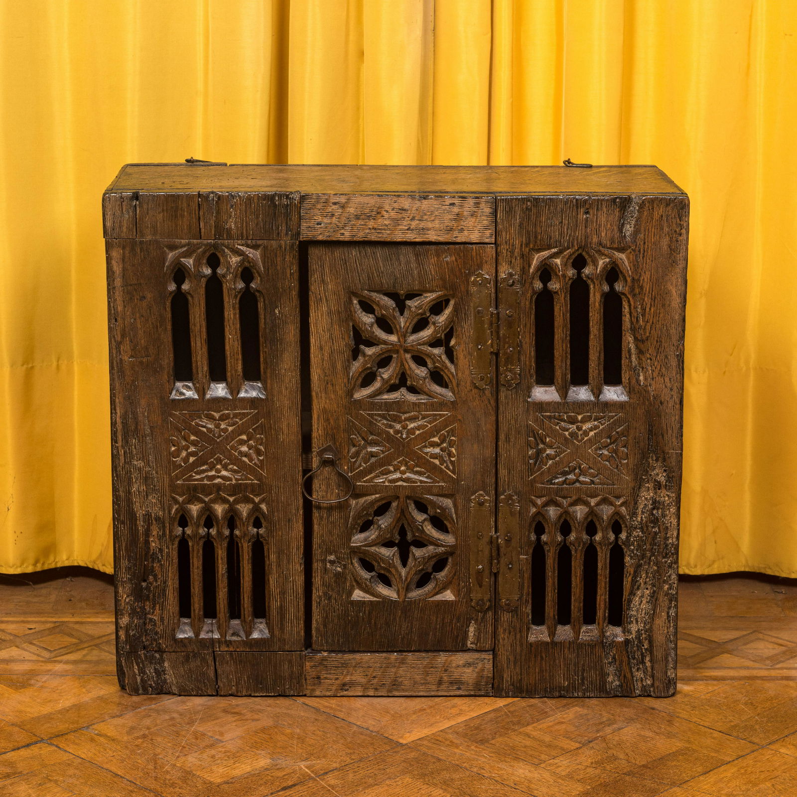 An English gothic style carved oak hanging cupboard composed of old elements, 17th C. and later (1 of 6)