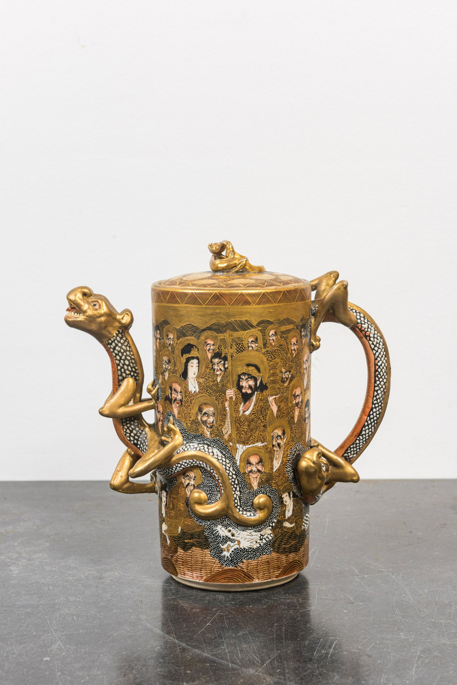 A Japanese Satsuma 'dragon spout' ewer and cover, Meiji, 19th C.: Full title: A Japanese Satsuma 'dragon spout' ewer and cover, Meiji, 19th C. Description: H 29 cm