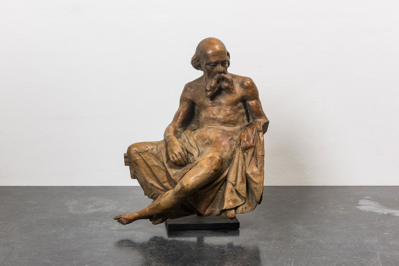 A walnut figure of Saint Jerome seated and partly undressed, 17/18th C. (1 of 2)