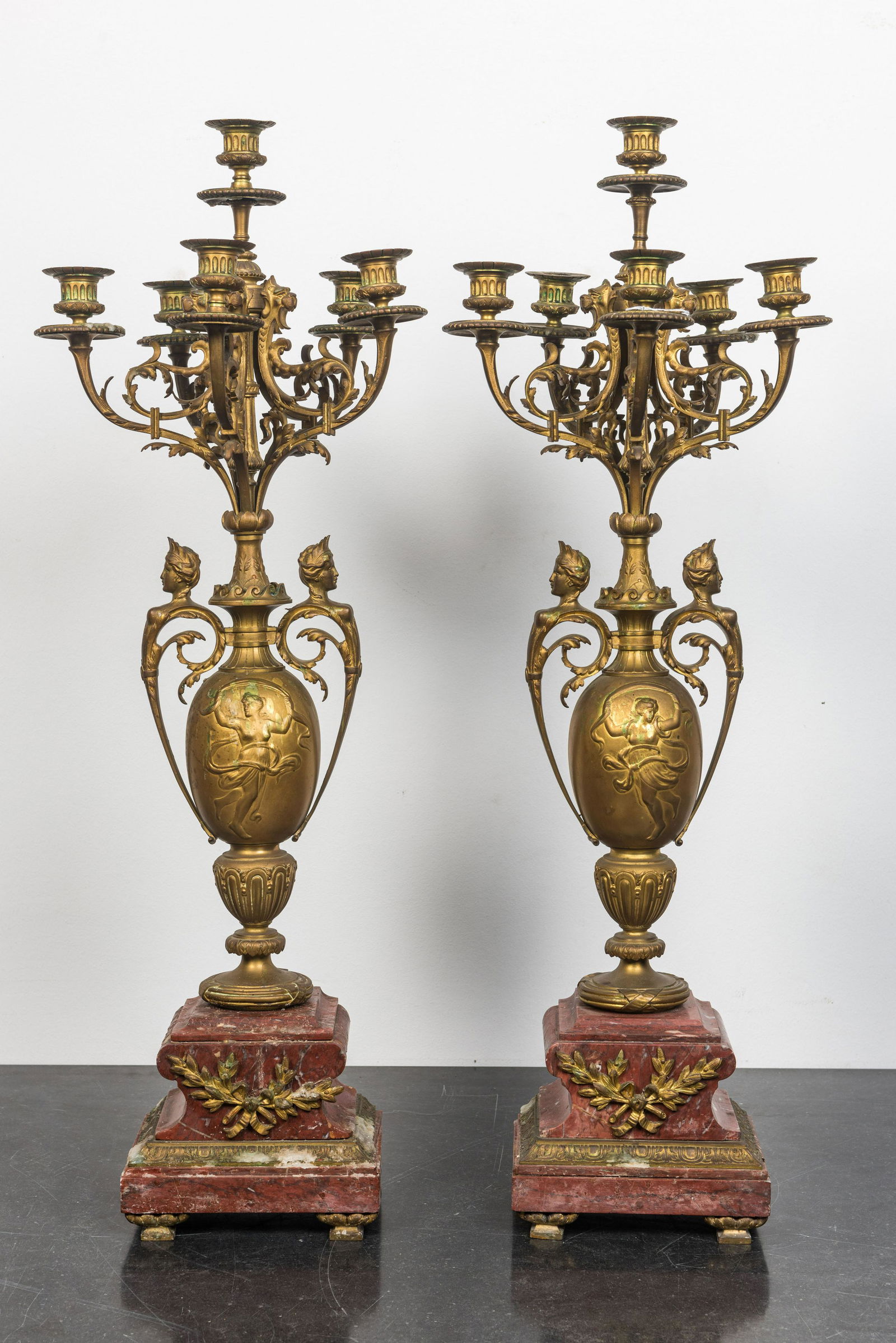 A pair of large gilt brass candelabra on red marble bases, 19th C. (1 of 2)