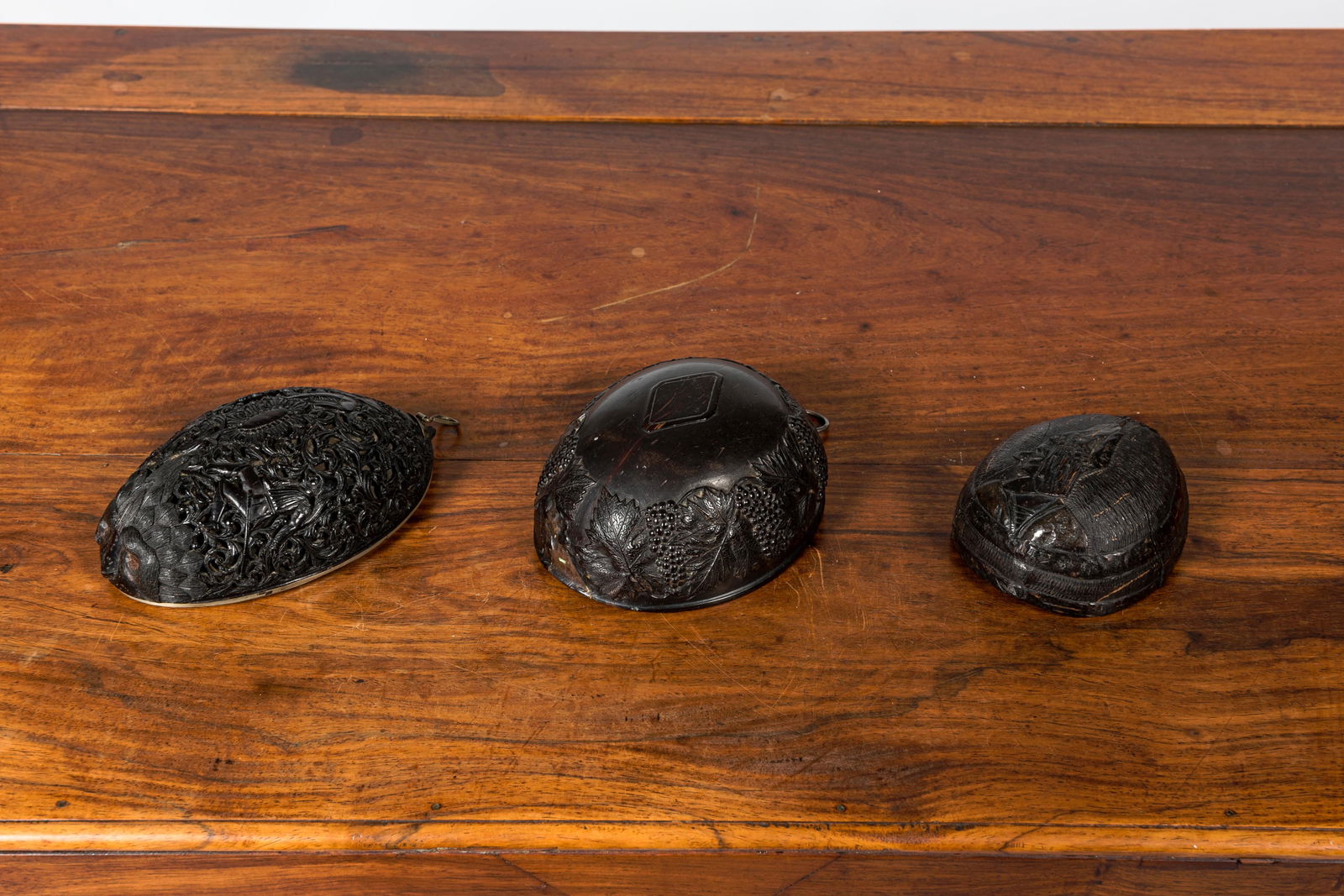 Three carved coconut pendants, French colonies, 19th C. (1 of 3)