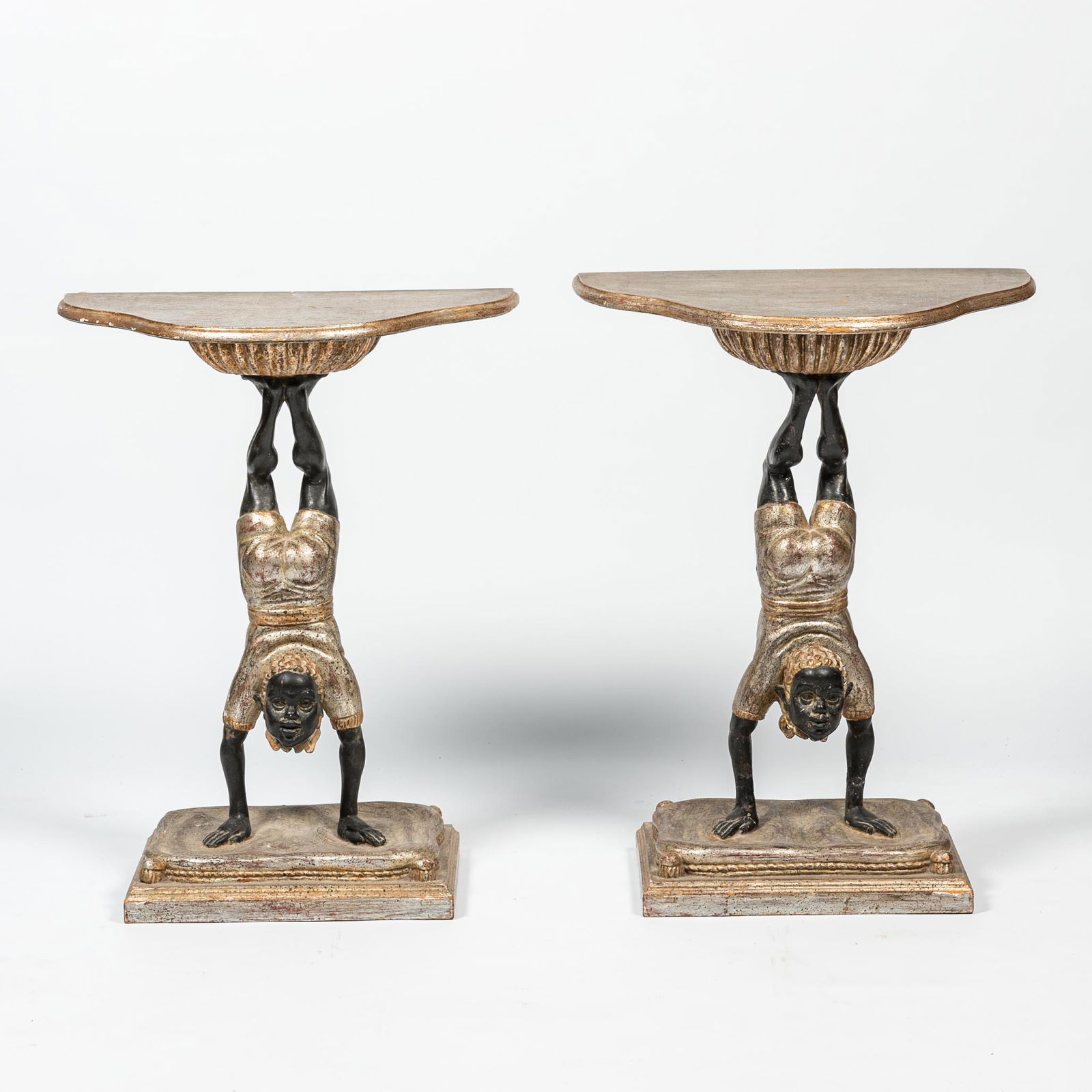 A pair of Venetian polychrome wooden 'blackamoor' consoles, 19th C. (1 of 2)