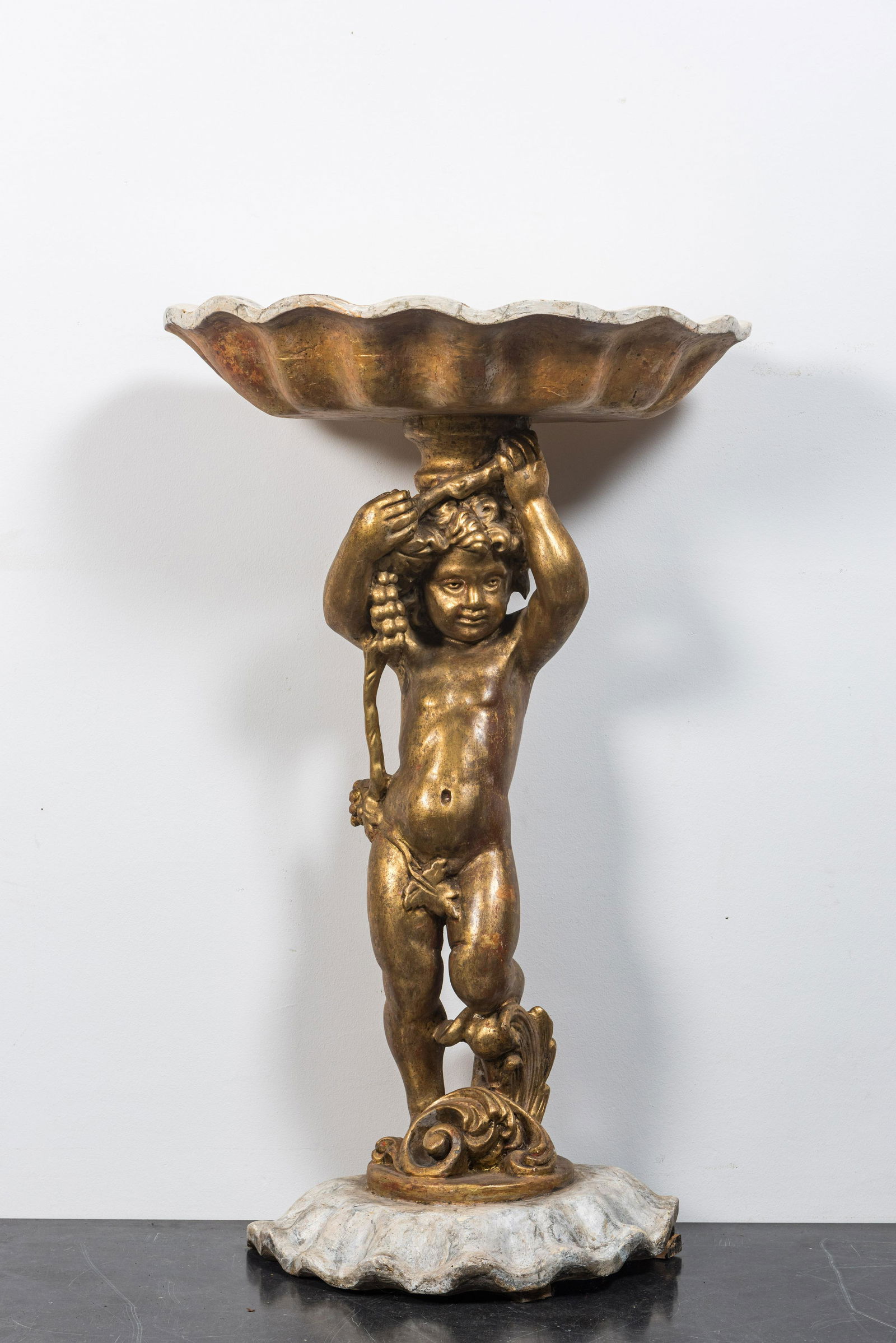 A faux marbre basin on gilt wooden putto stand, Italy, 19th C. (1 of 3)