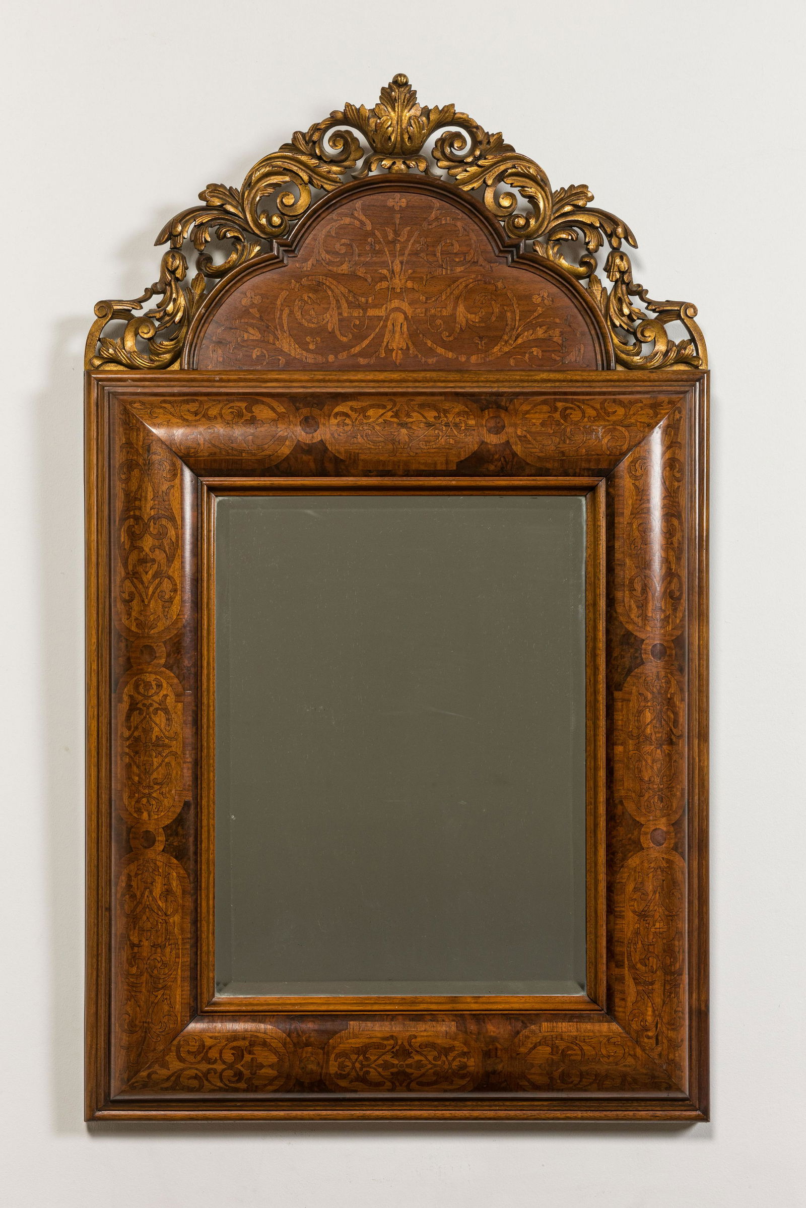 A wooden marquetry mirror with gilt wooden ornamental crown, 19th C. (1 of 4)