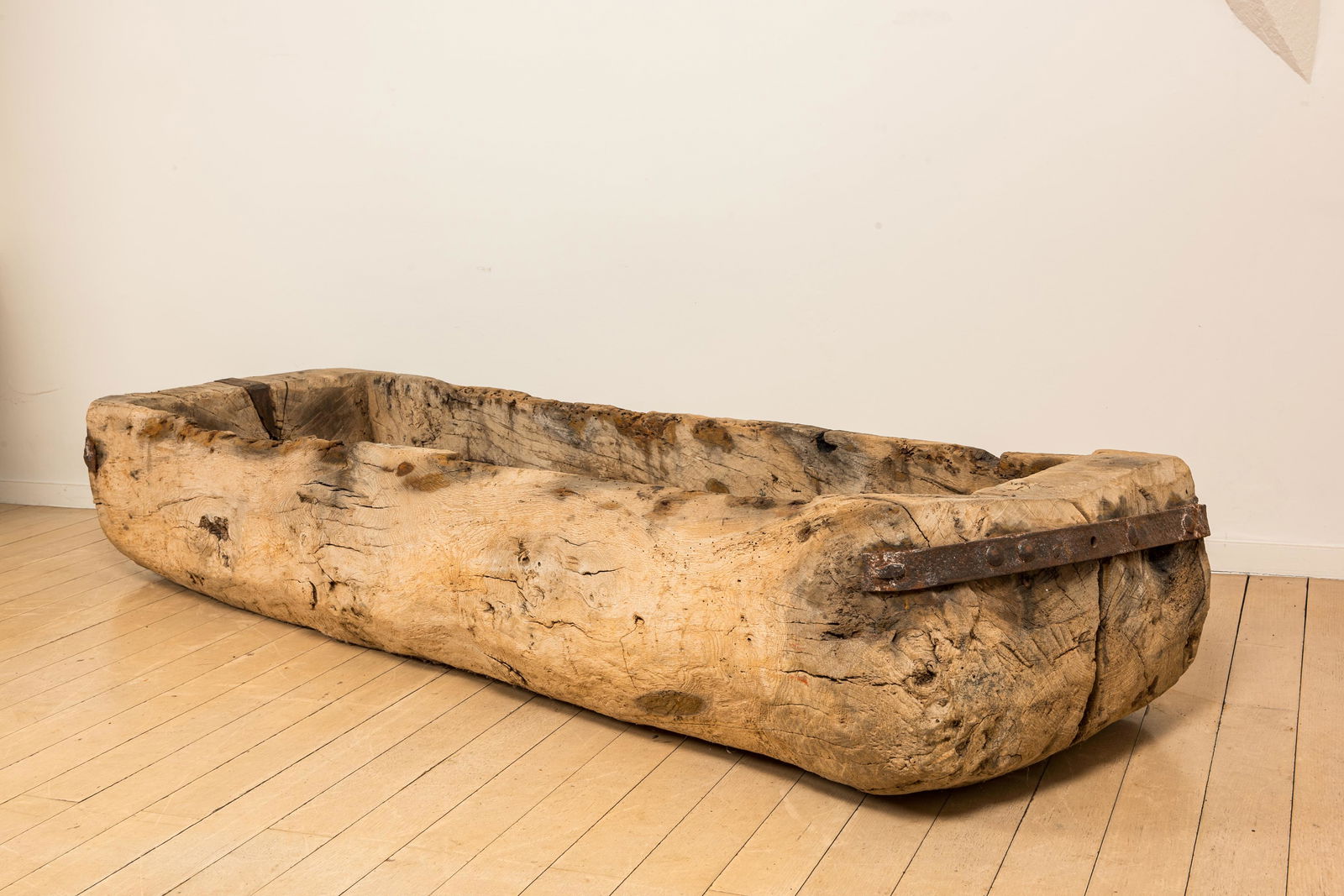 A wooden trough with iron mounts, 18th C. (1 of 2)