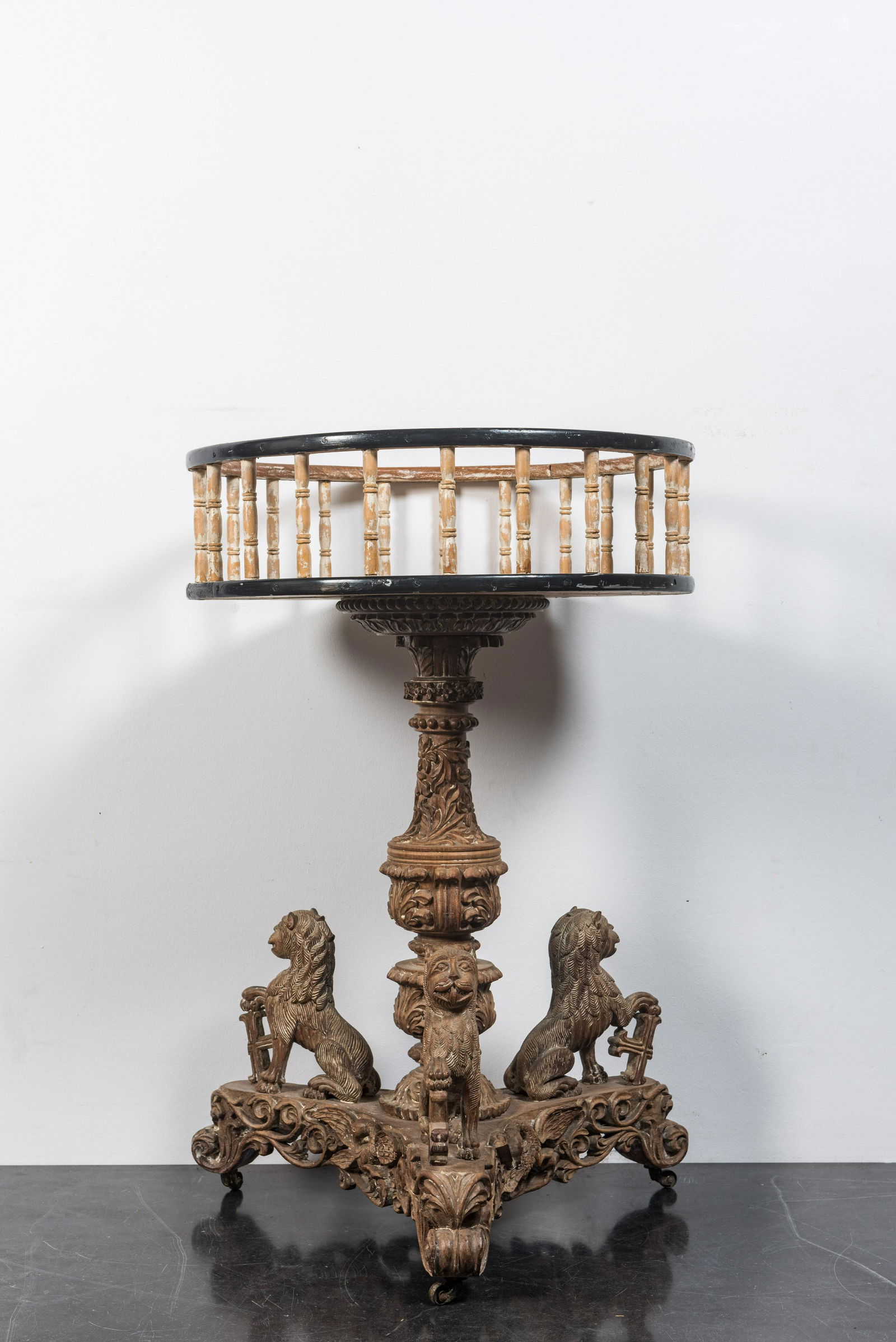 A large patinated wooden tripod jardiniÃ¨re, 19th C. (1 of 2)