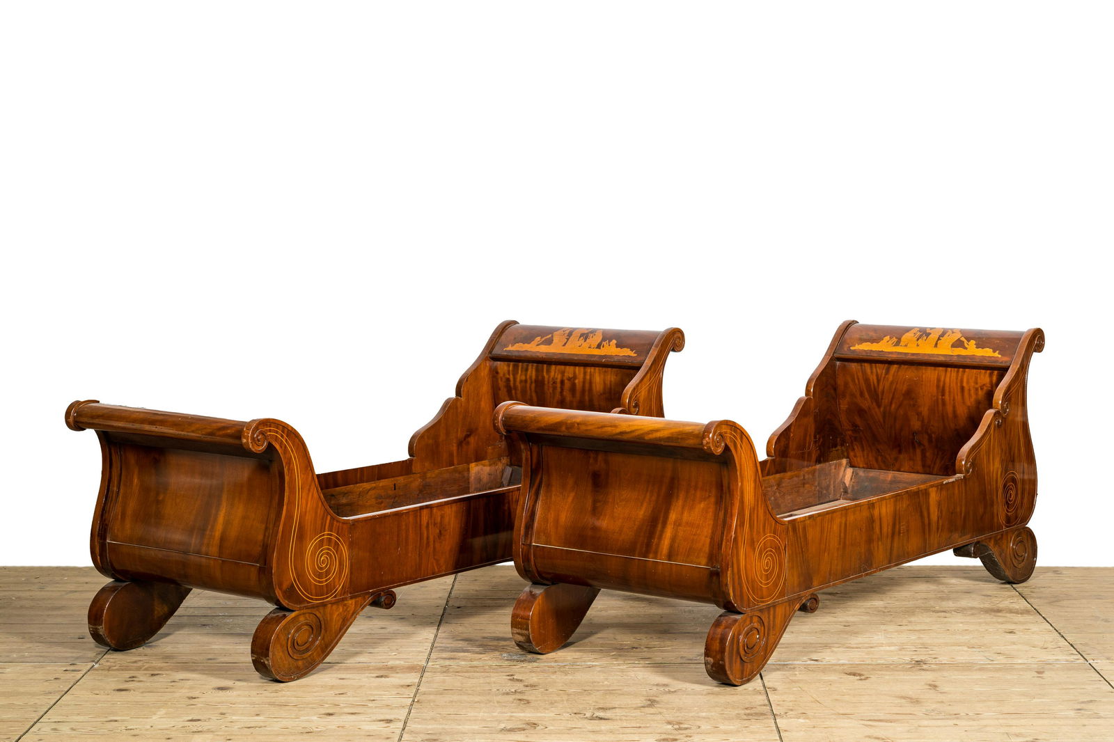 A pair of French mahogany beds or 'lits en bateau', 19th C. (1 of 4)