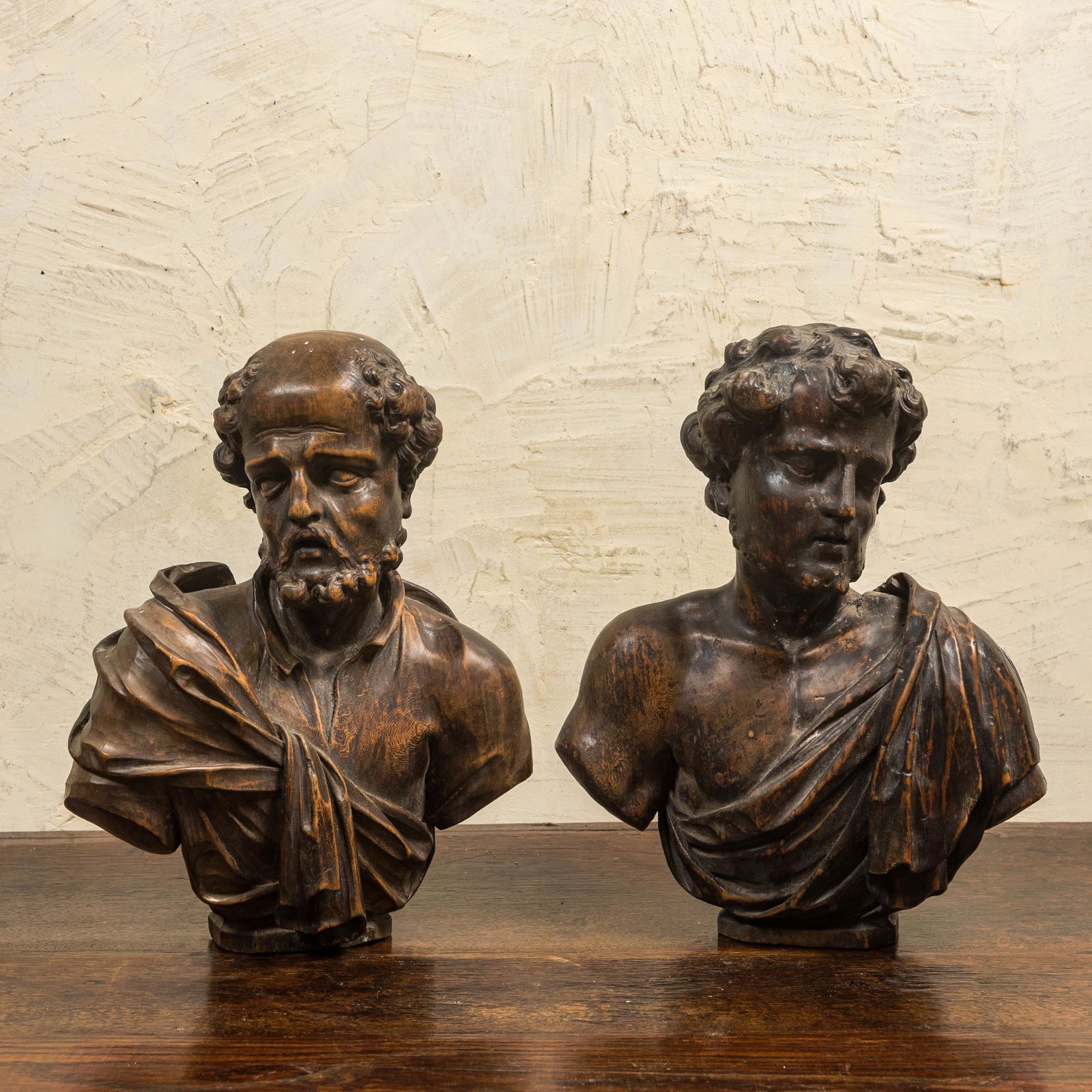 A pair of Italian walnut busts of males, 17th C. (1 of 2)