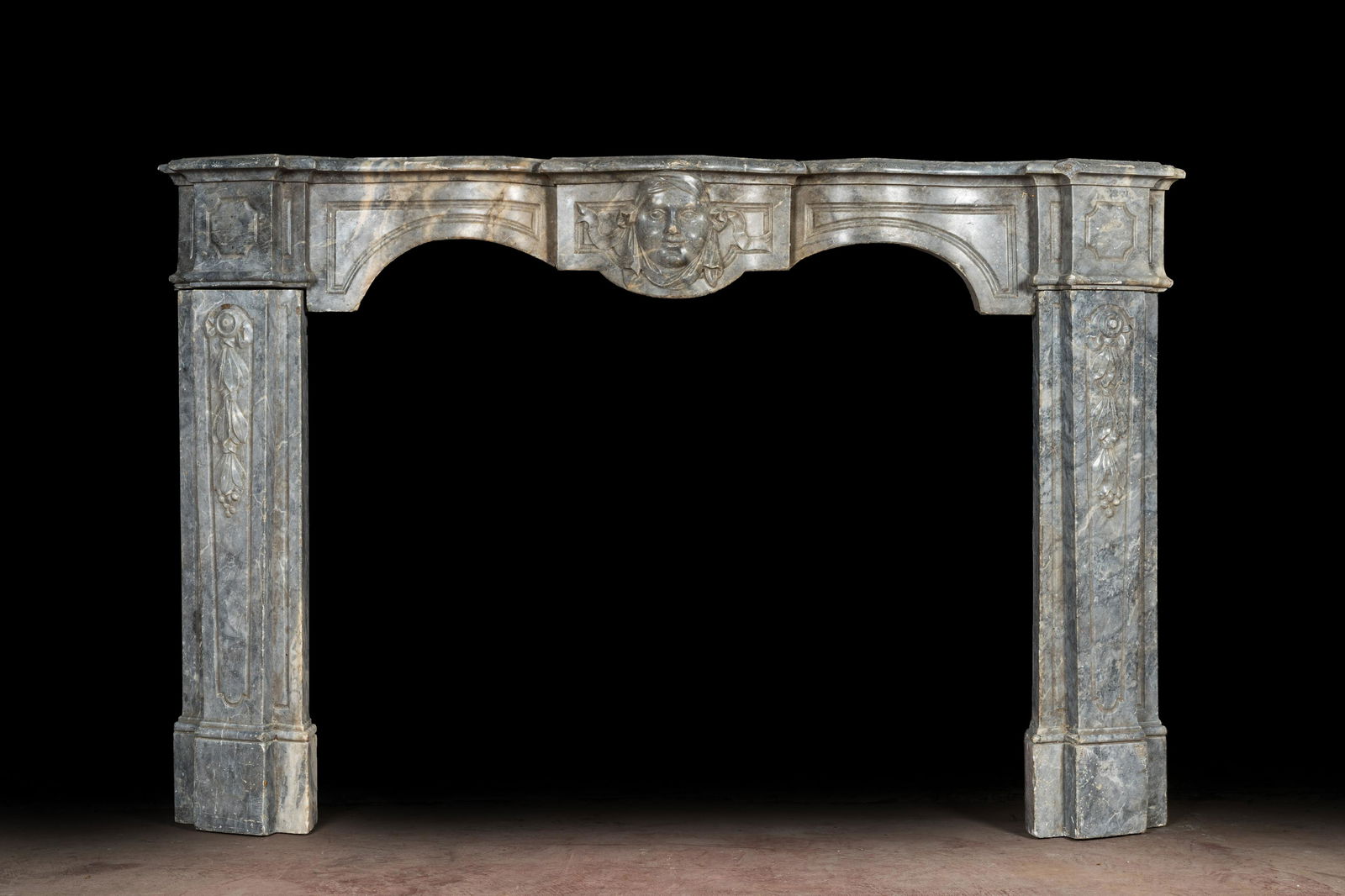 A French Louis XV style gray marble fireplace with mascaron, 19th C. (1 of 5)