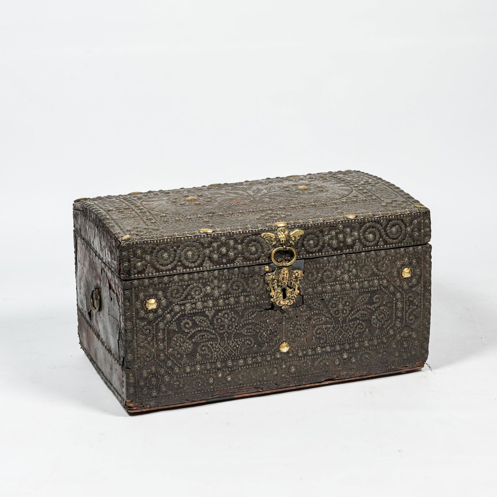 A leather upholstered brass-mounted wooden coffer, 17th C. (1 of 4)