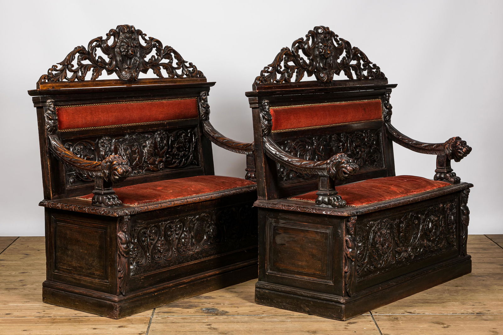 A pair of richly carved wooden hall benches, 19th C. (1 of 7)