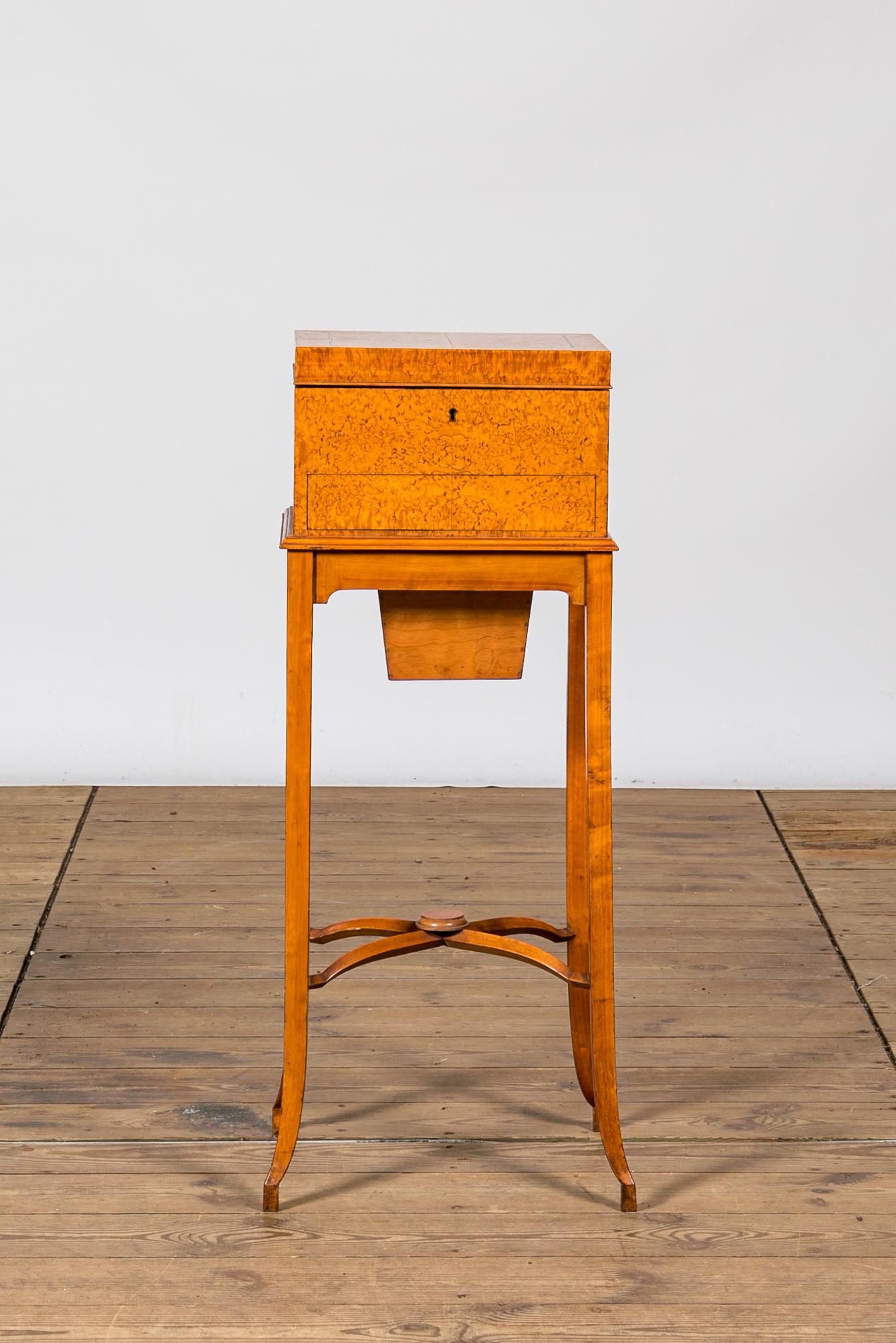 A fruitwood and burl wood veneered vanity set on foot, 20th C.: Full title: A fruitwood and burl wood veneered vanity set on foot, 20th C. Description: H 82,5 x L 34,5 x D 30 cm