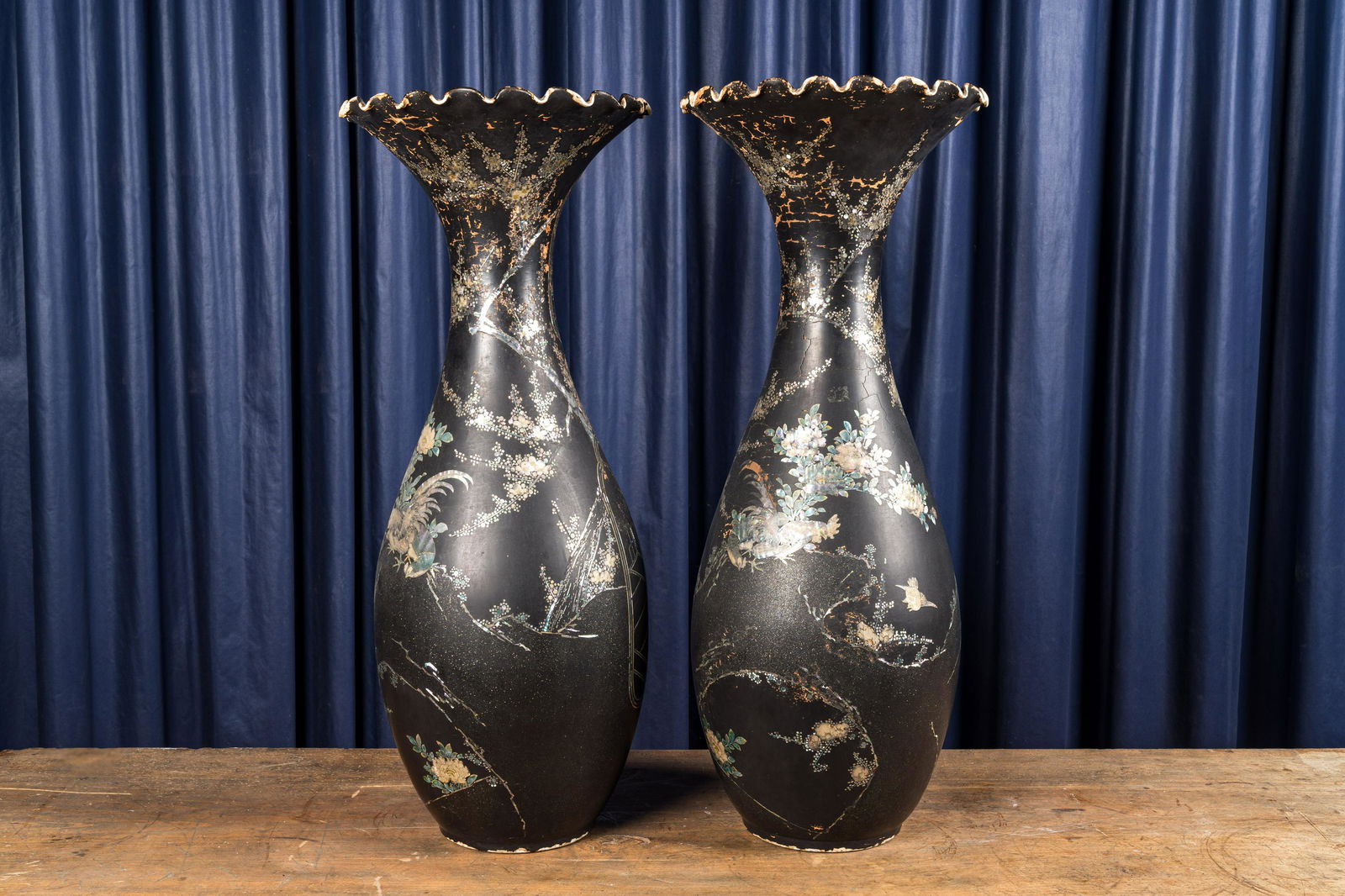 A pair of large mother-of-pearl-inlaid black-lacquered Japanese vases with fan-shaped rims, Meiji, (1 of 2)