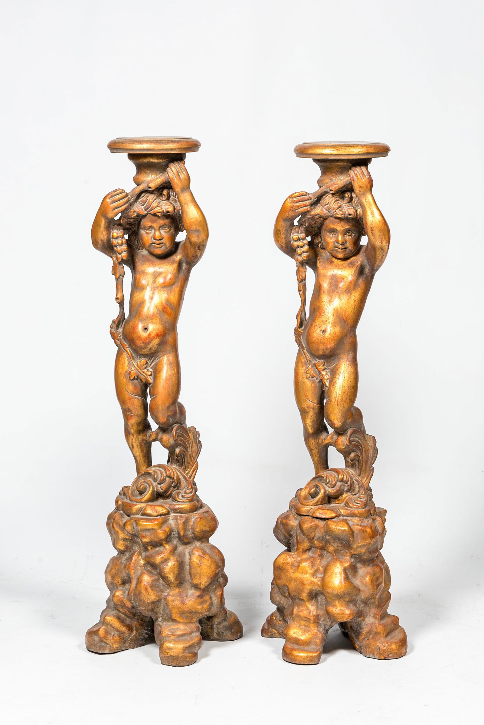 A pair of gilt wooden bacchante-shaped pedestals, 19/20th C. (1 of 2)
