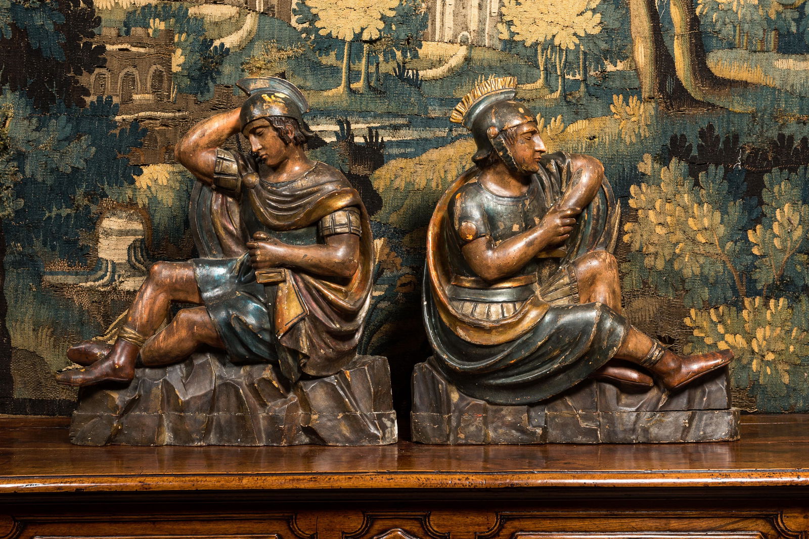 A pair of polychrome wooden sculptures of Roman soldiers, 18th C. (1 of 2)