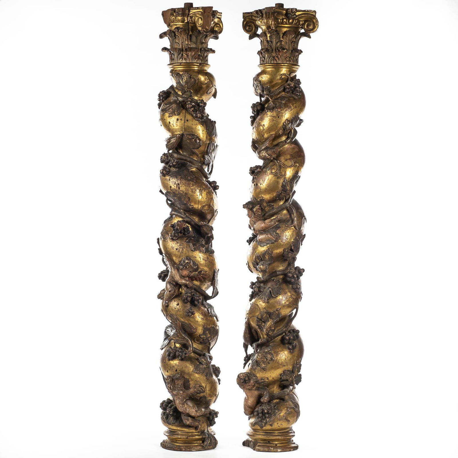 A pair of twisted and partly gilt wooden columns with birds and grapevines, prob. Italy, 17/18th C. (1 of 3)