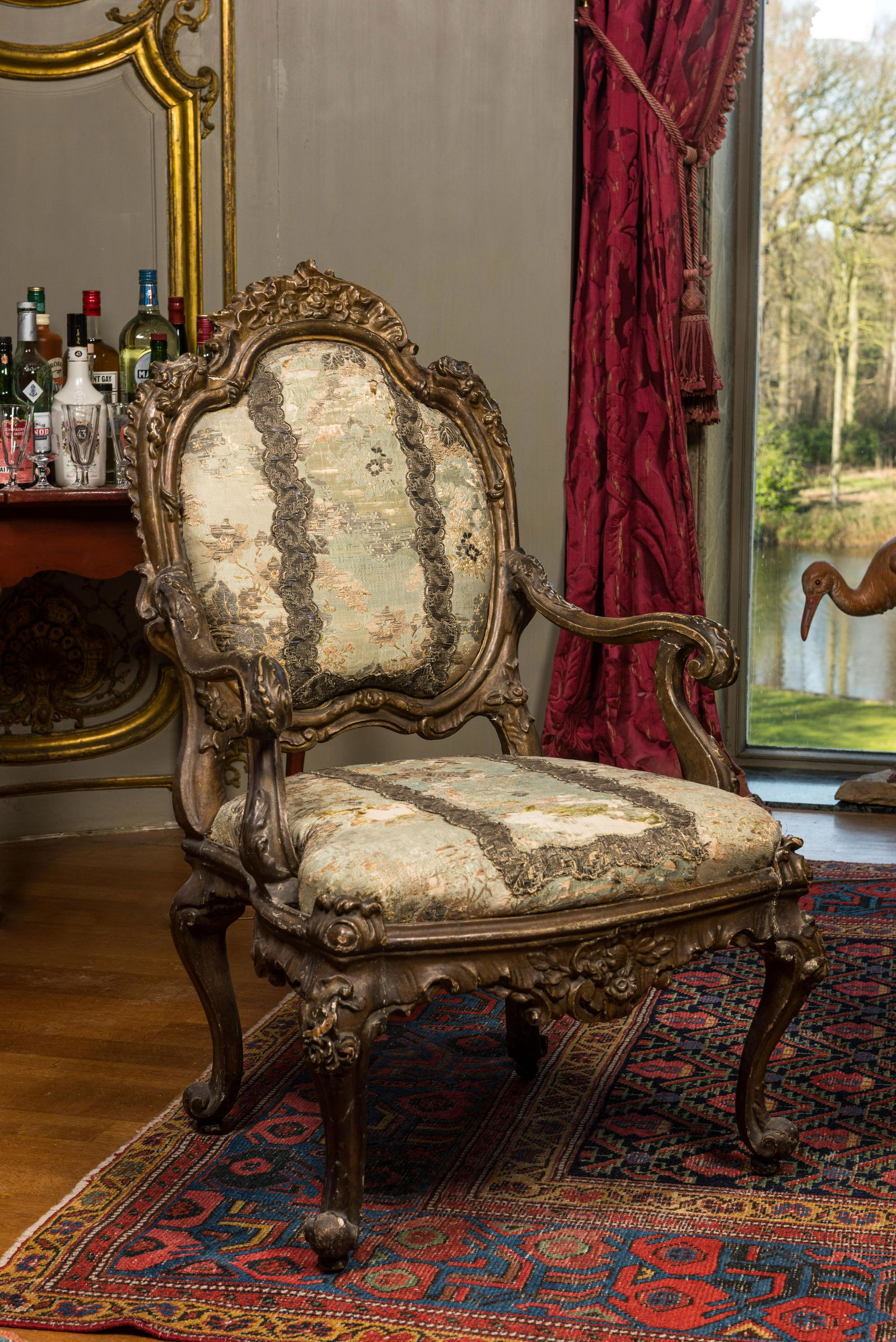 An Italian gilt carved wooden Louis XV armchair upholstered with silver brocade, 18th C. (1 of 3)