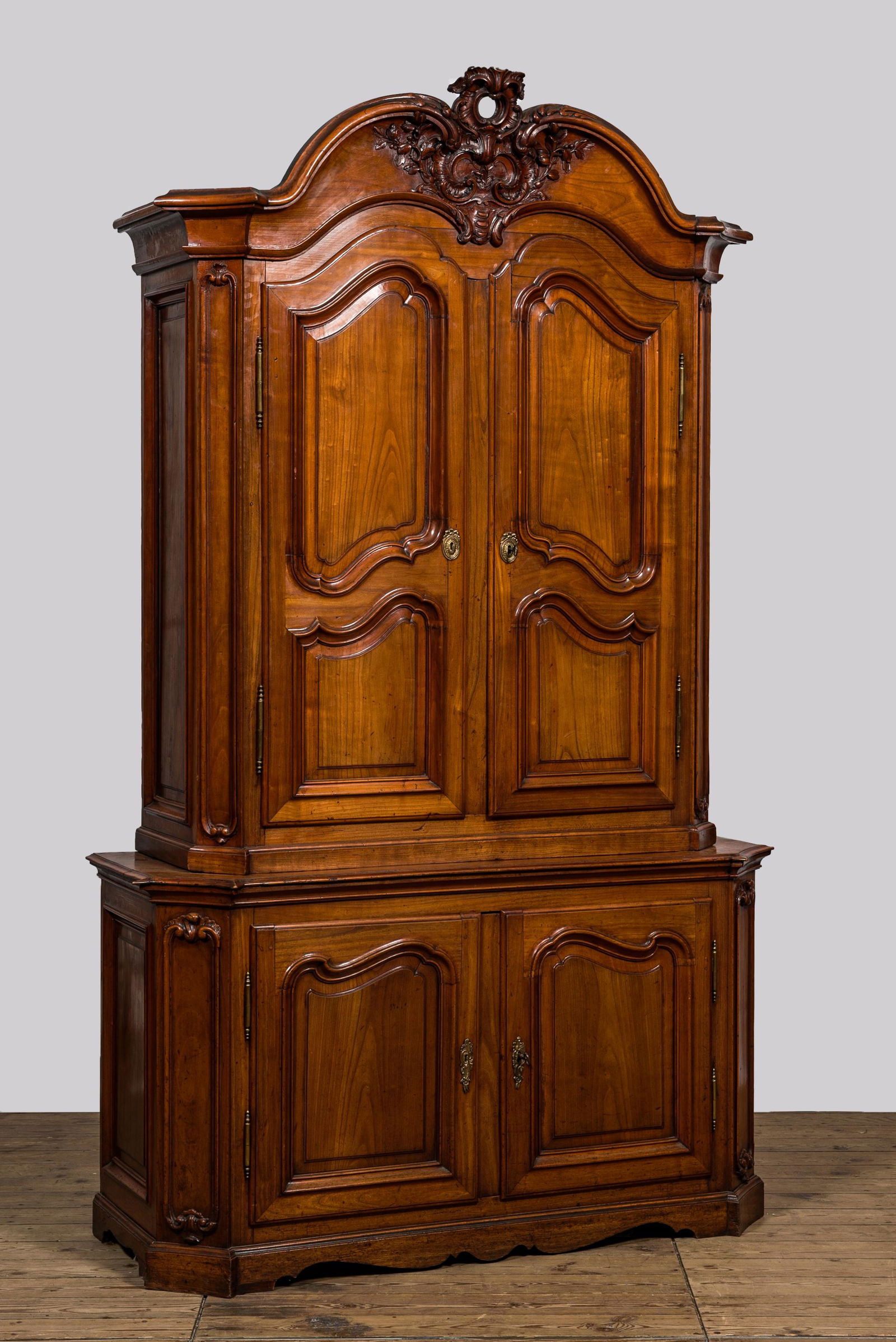 A French Louis XV-style cherry wooden deux corps, 18th C. (1 of 3)