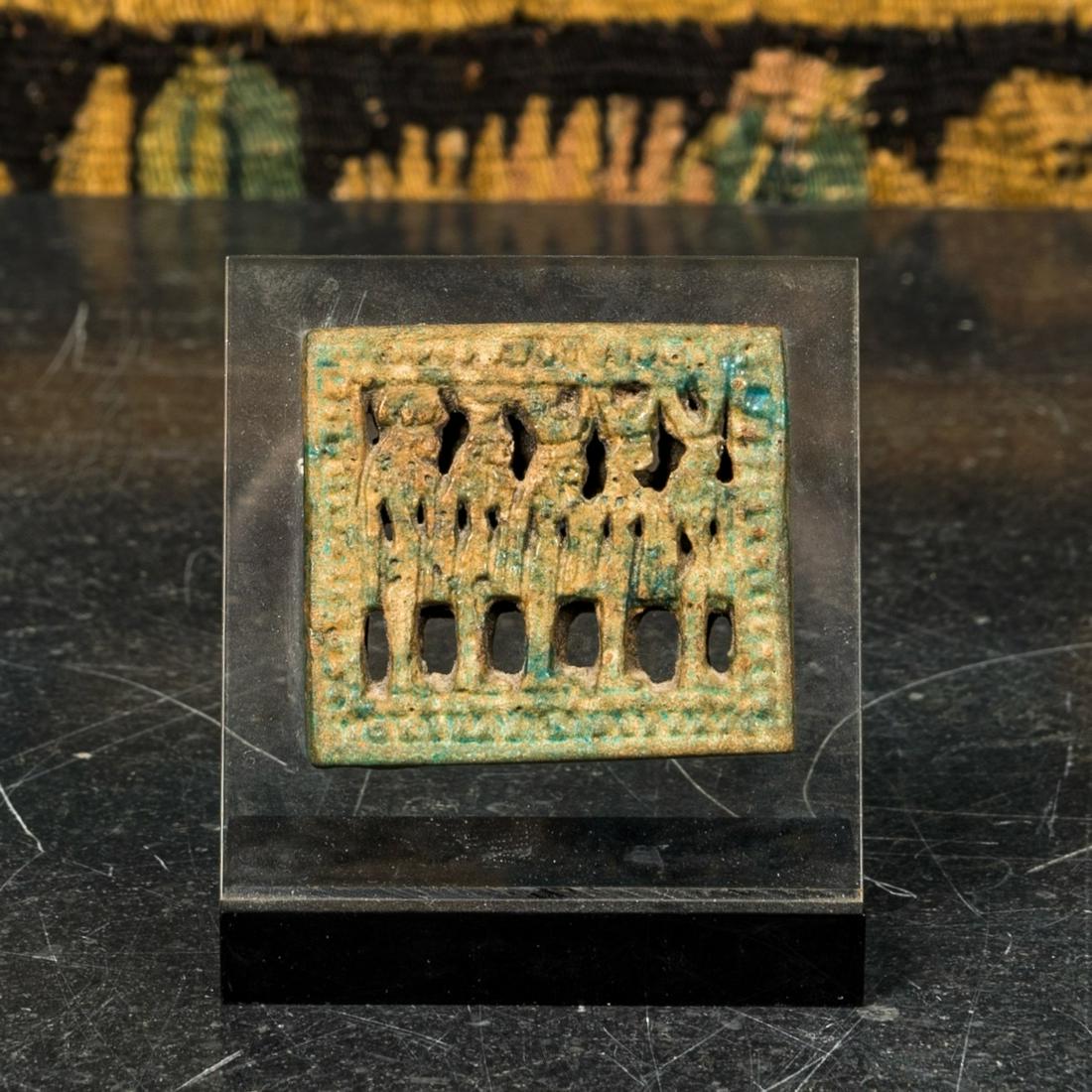 A reticulated turquoise-glazed Egyptian faience amulet plaque, 4th/1st C. b.C. (1 of 3)
