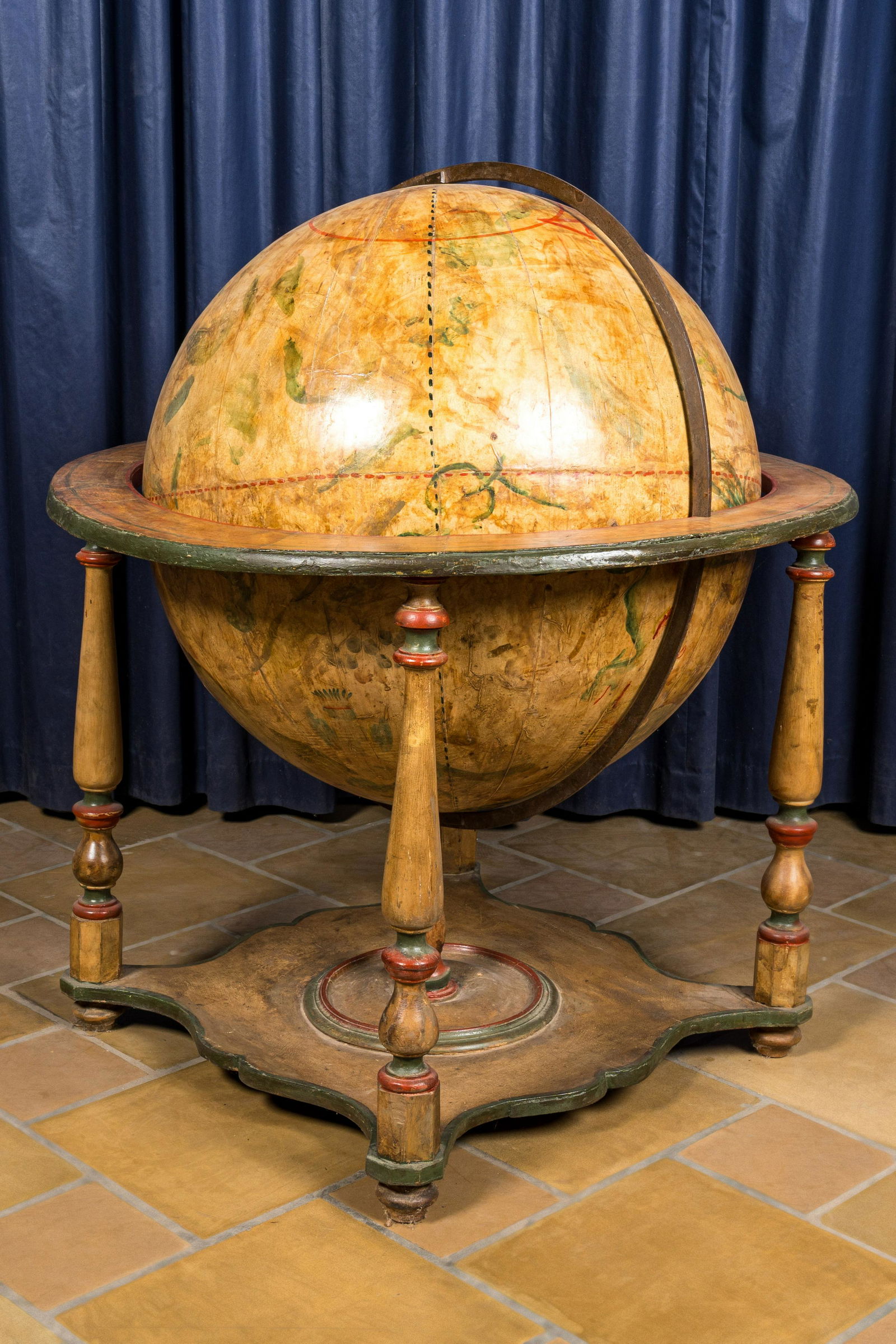 A celestial globe on a polychrome wooden base, 19th C. (1 of 3)