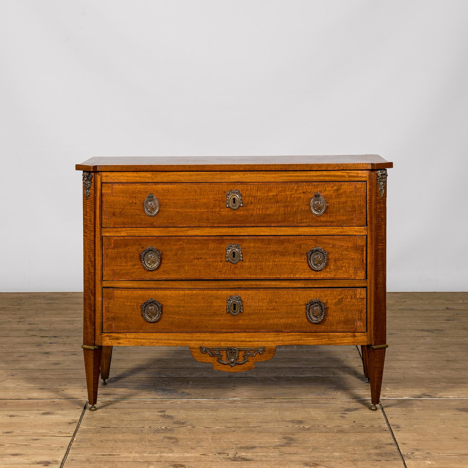A Neoclassical mahogany chest of drawers, ca. 1900 (1 of 3)