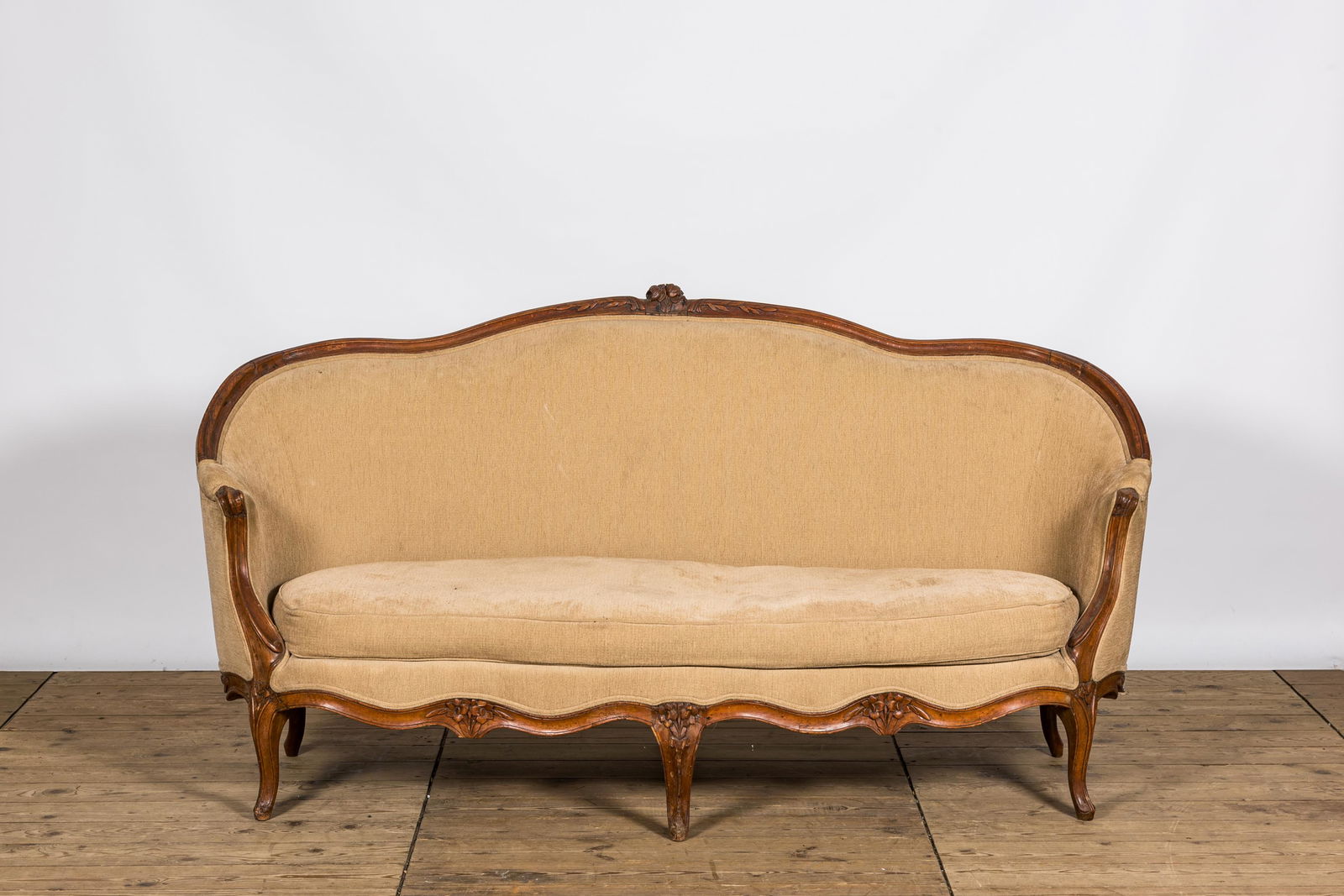 A French wooden Louis XV-style 'ottoman' sofa, 18/19th C. (1 of 2)