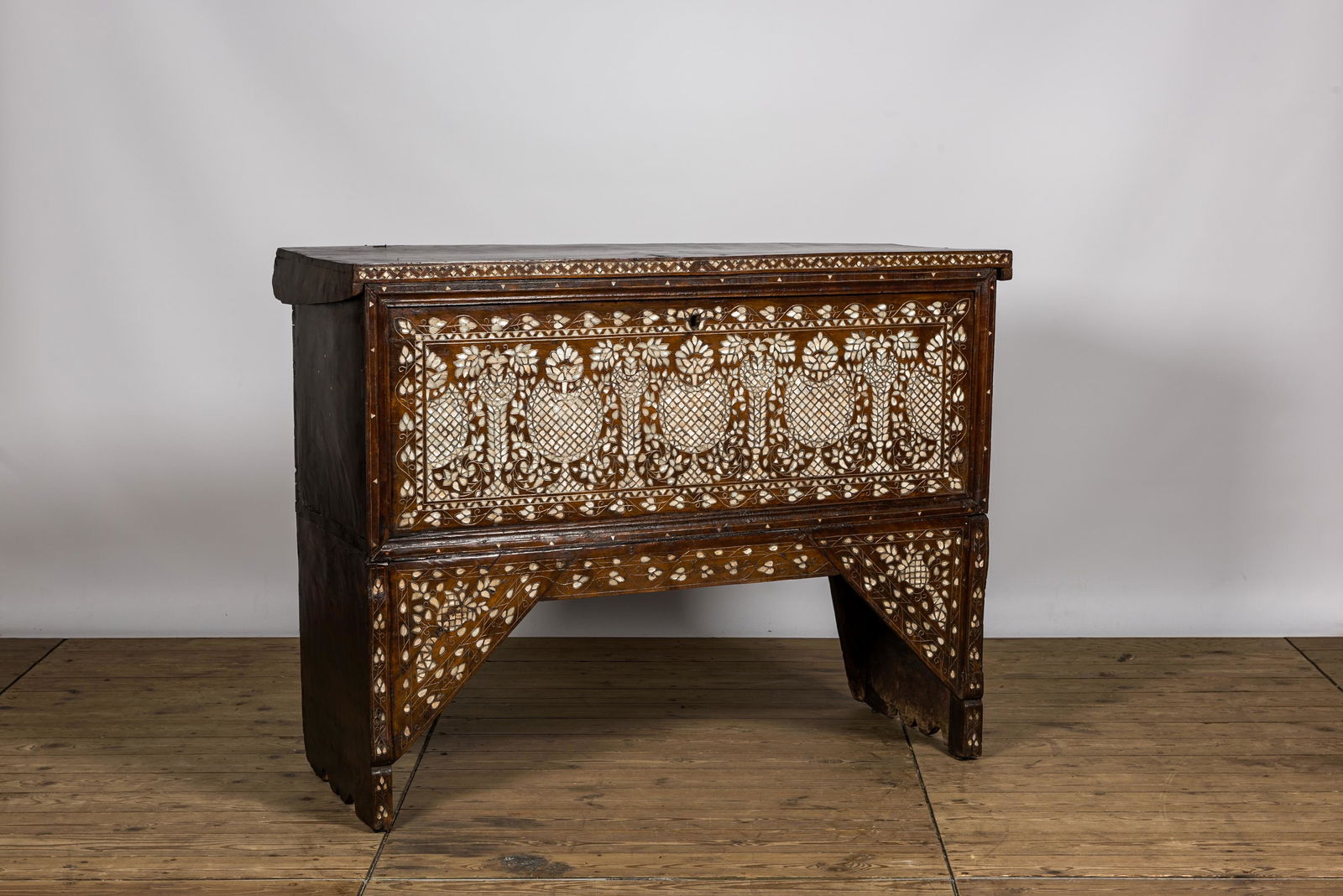A Syrian mother-of-pearl-inlaid wooden bridal chest on stand, 19th C. (1 of 4)