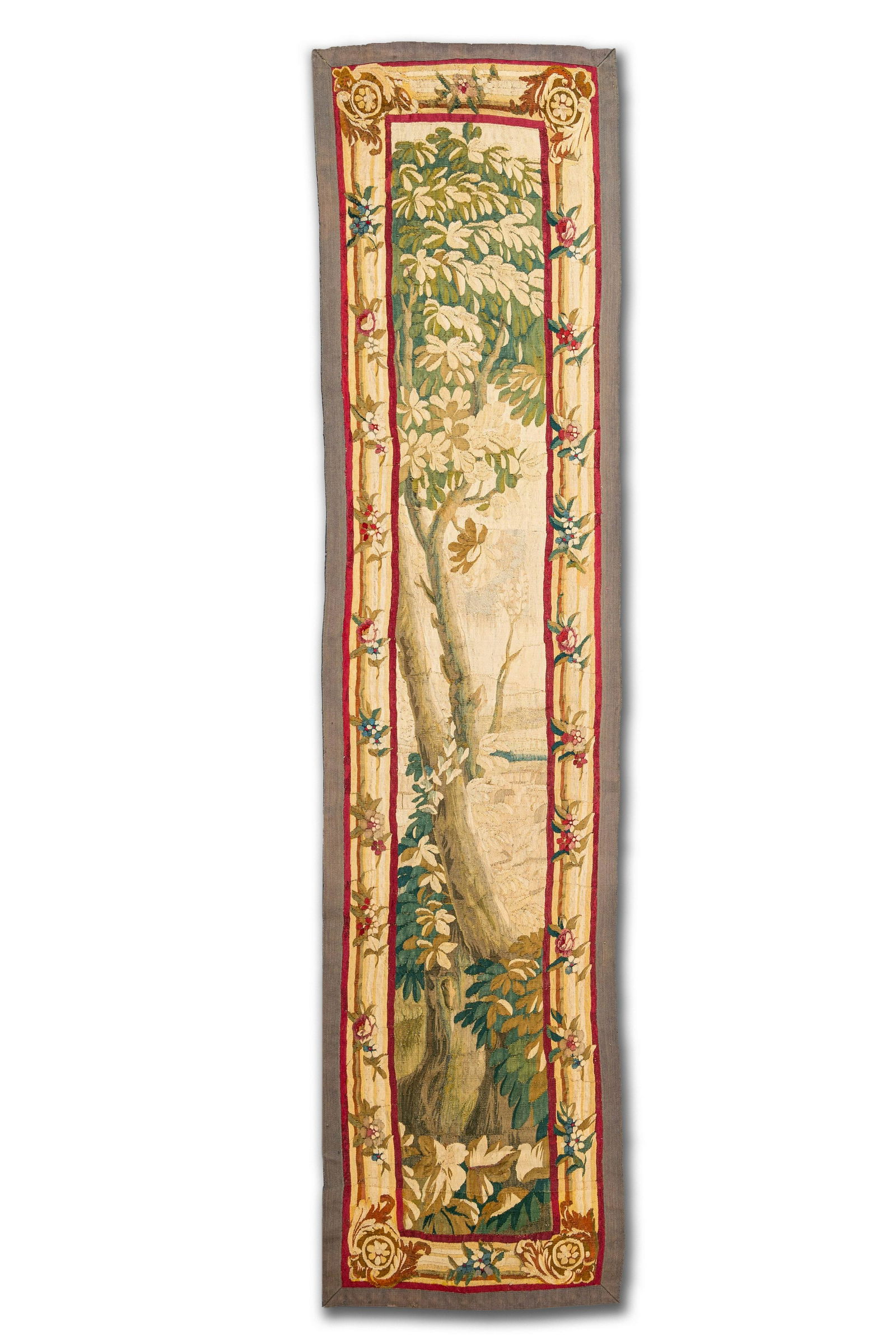 A vertical Flemish wall hanging tapestry depicting a tree, 17th C.: Full title: A vertical Flemish wall hanging tapestry depicting a tree, 17th C. Description: H 266,5 x 63,5 cm About this sale: Paul De Grande is one of the major dealers of antique furniture, fine scu