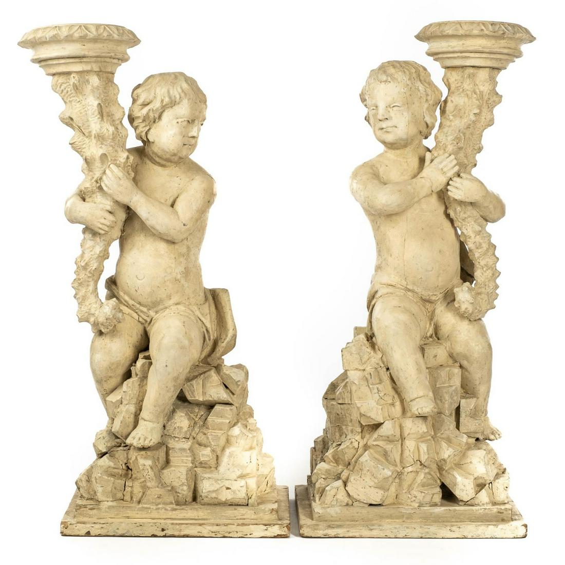 A pair of white patinated wooden putti holding a cornucopia, 18th C. (1 of 6)