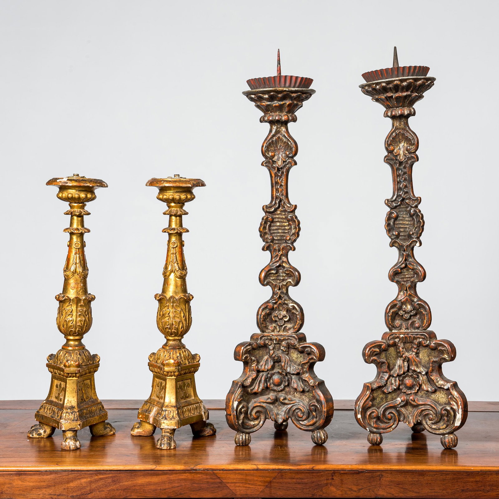 Two pairs of polychromed and gilt wooden candlesticks, France and Italy, 18/19th C.: Full title: Two pairs of polychromed and gilt wooden candlesticks, France and Italy, 18/19th C. Description: H 68 cm (the tallest) H 46 cm (the smallest) About this sale: Paul De Grande is one of the 