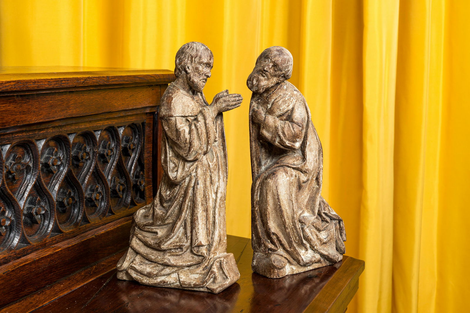 A pair of wooden figures of praying saints, 19th C. or earlier (1 of 2)