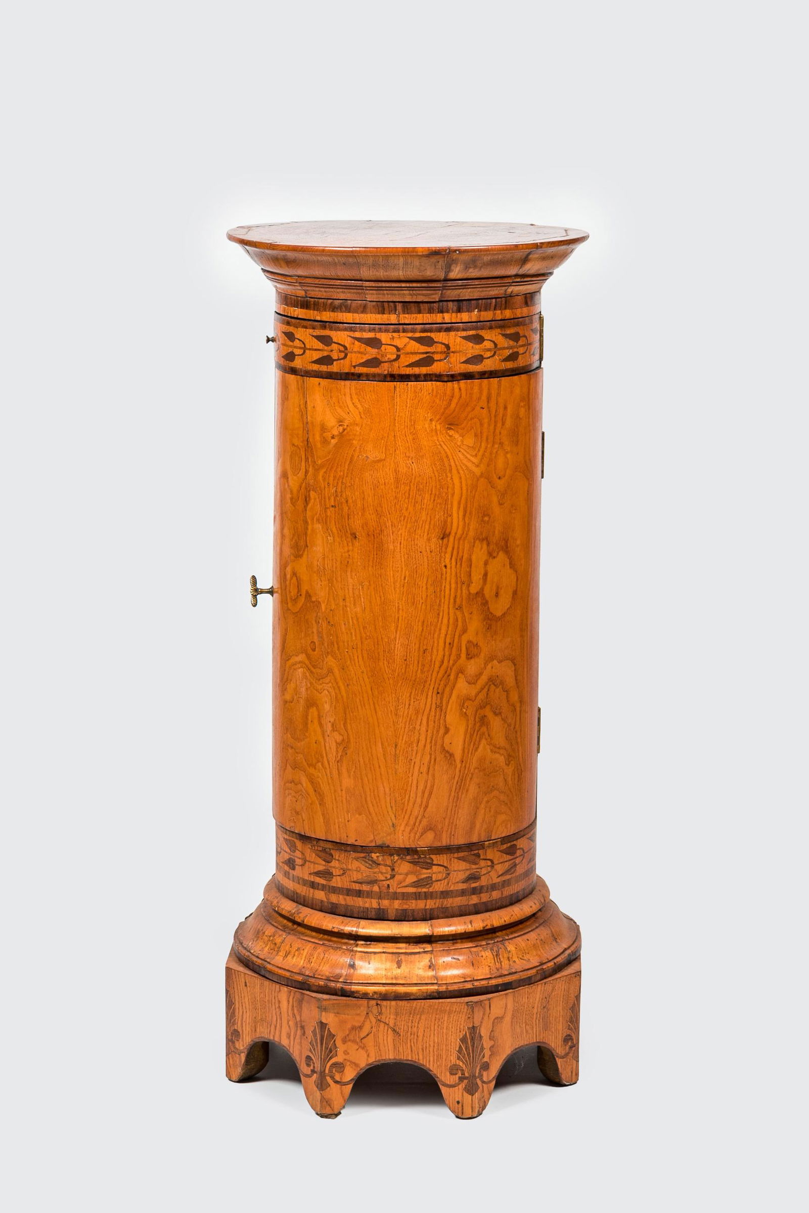 A round inlaid wooden one-door cabinet stand, 19th C. (1 of 2)