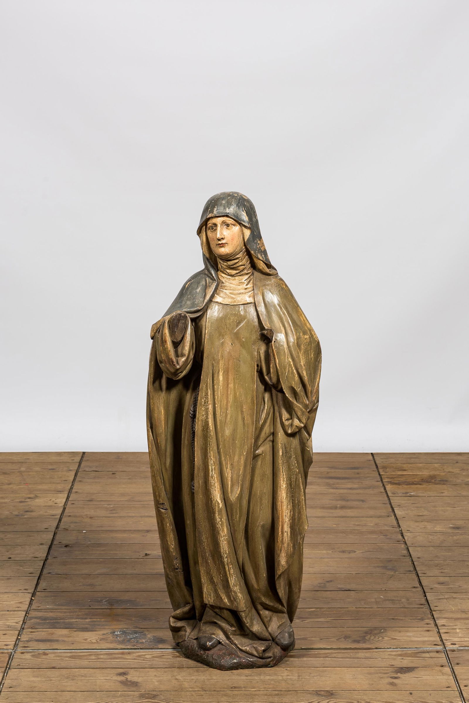 A polychrome wooden figure of Teresa of avila, 19th C. (1 of 2)