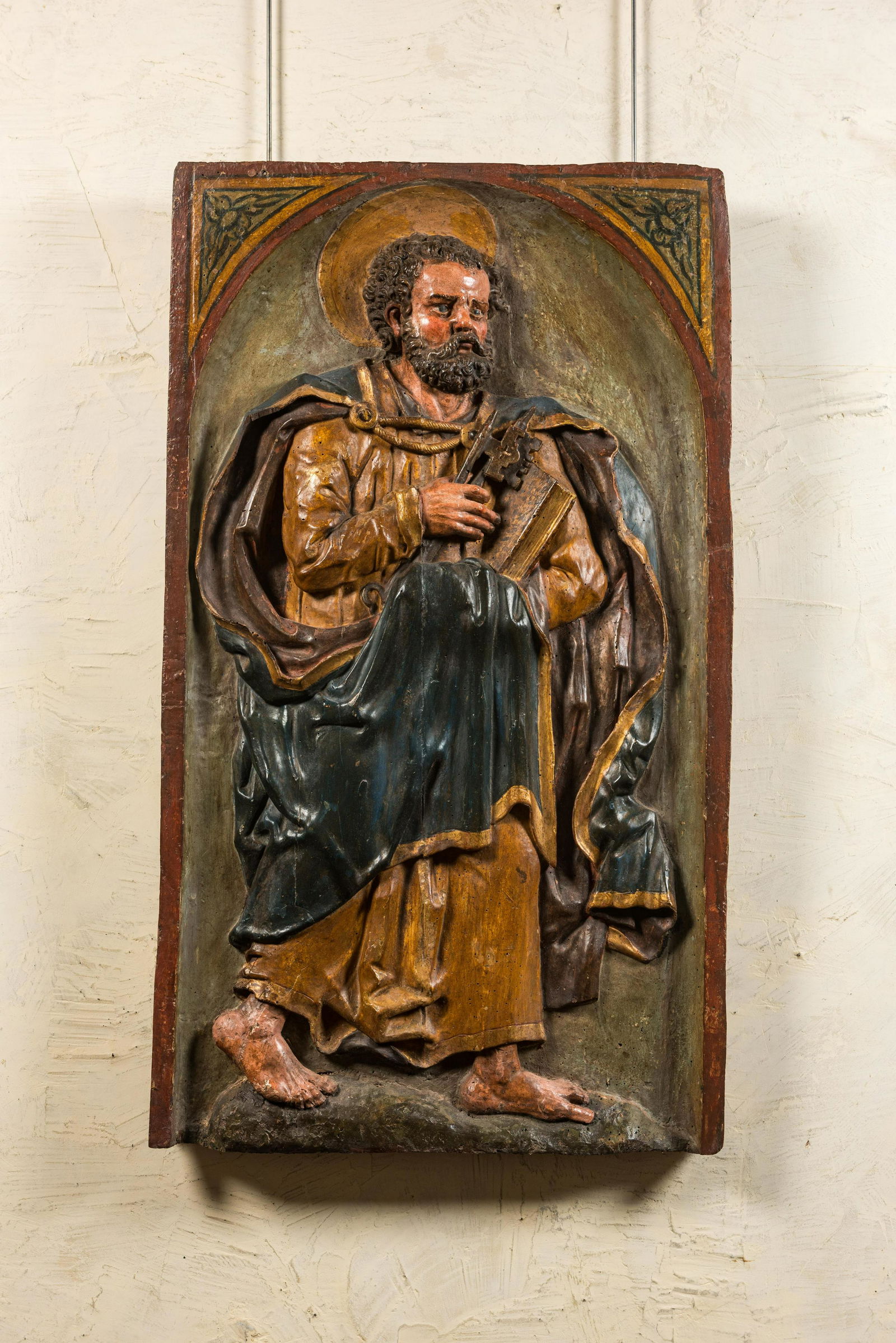 A large Spanish polychrome wooden alto relievo depicting Saint Peter, 17th C. (1 of 2)