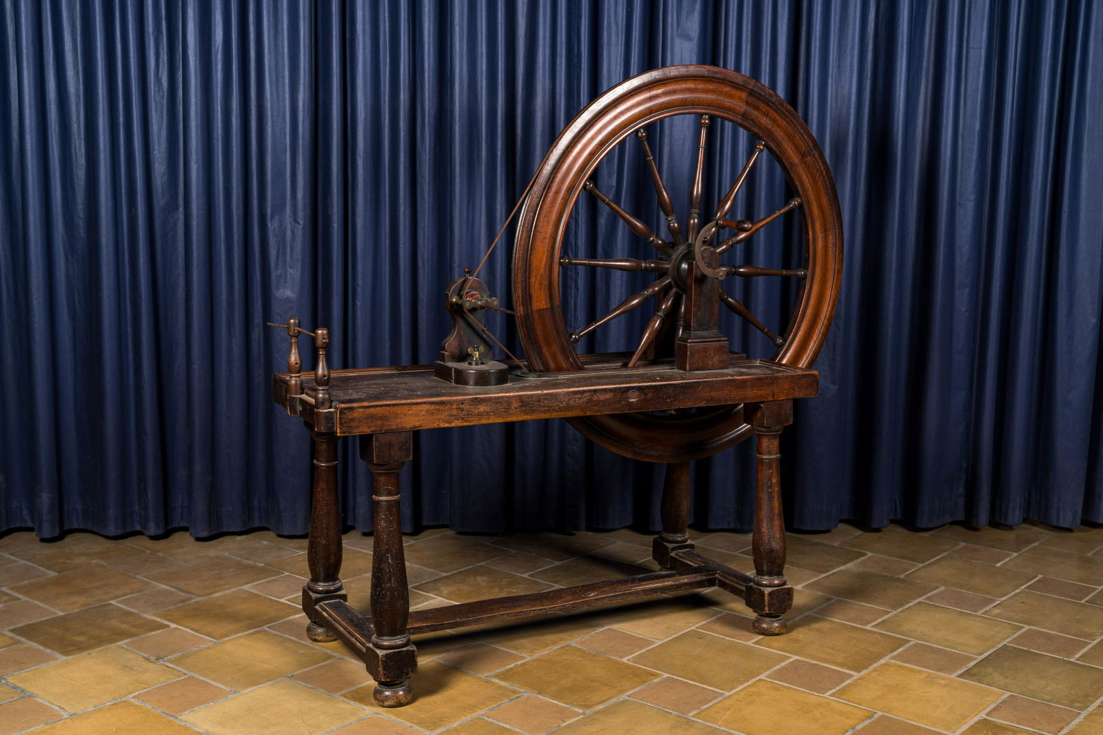 A mahogany spinning wheel, 19th C. (1 of 3)