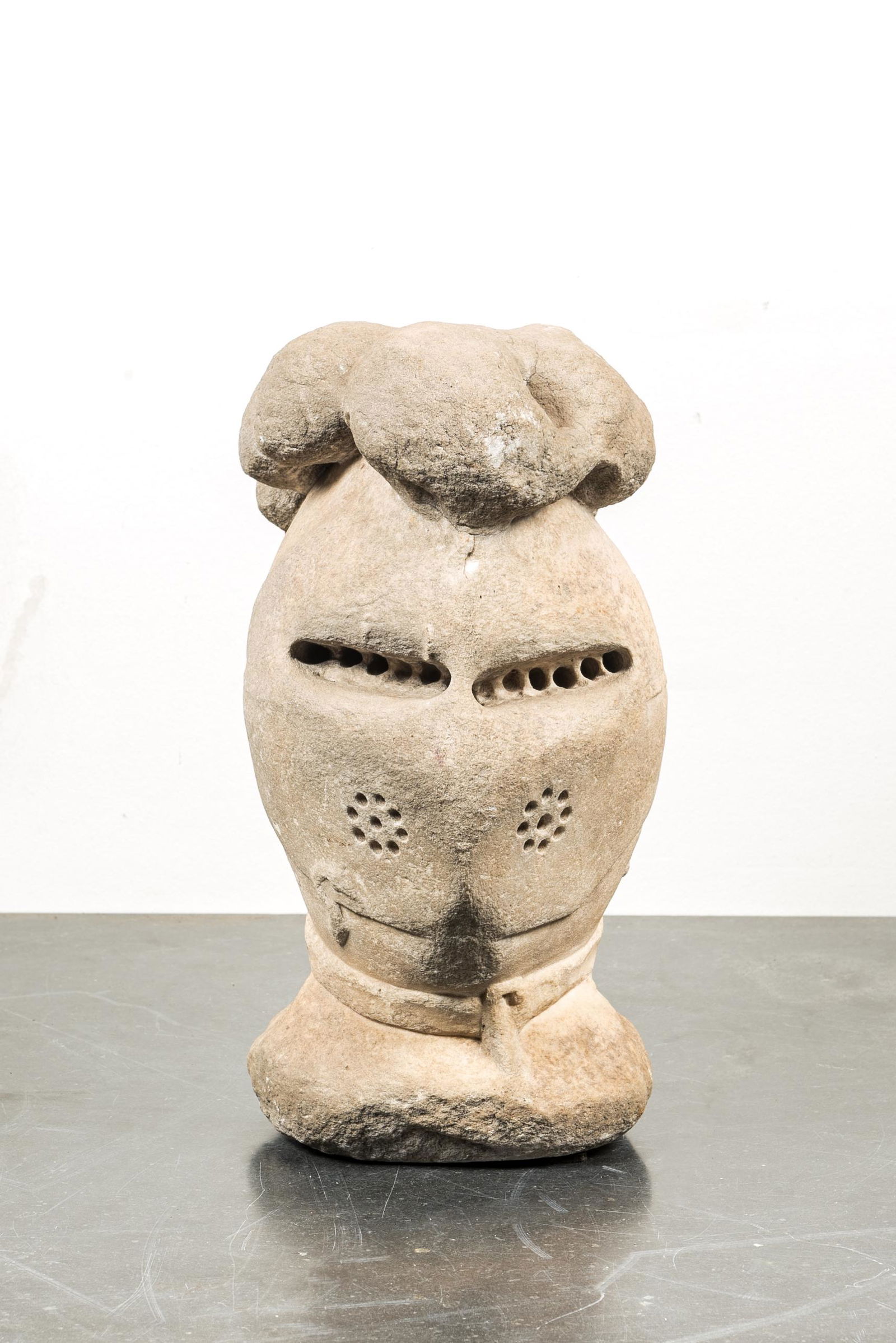 A carved stone model of a knight's helmet, probably France, 16/17th C. (1 of 3)