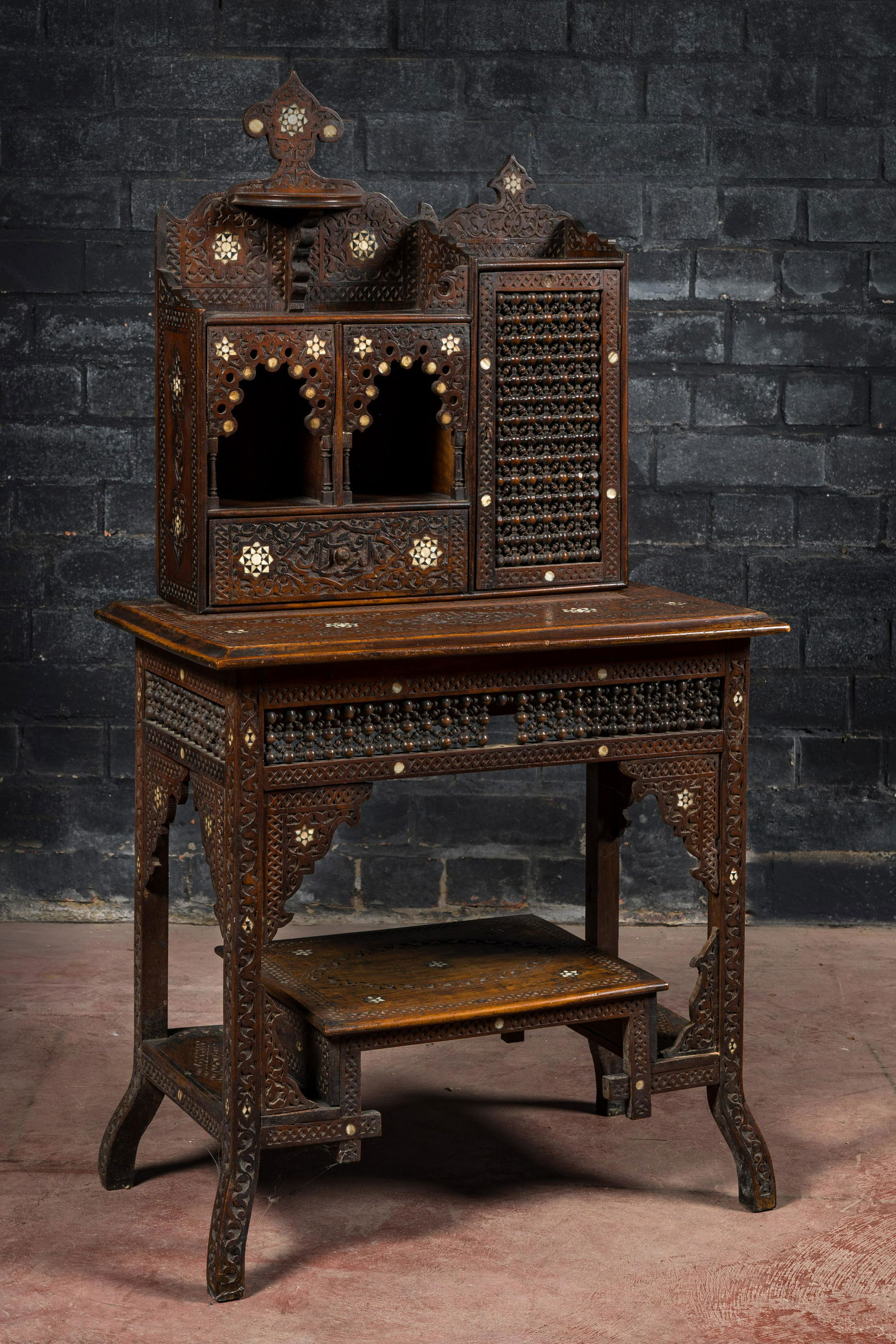 A mother-of-pearl-inlaid wooden wall console, North-Africa, 19/20th C. (1 of 4)