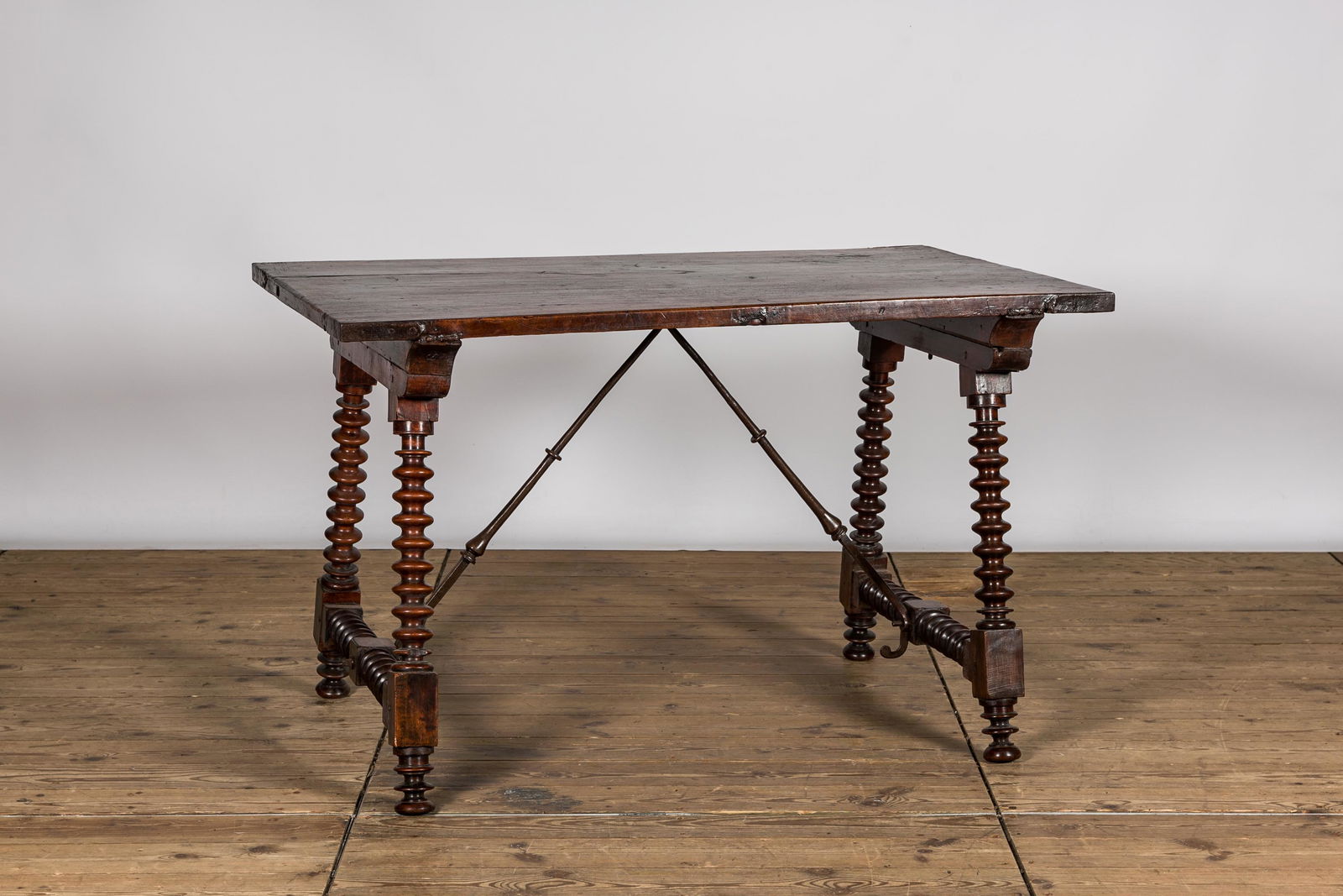 A Spanish walnut table, 17th C. and later (1 of 3)