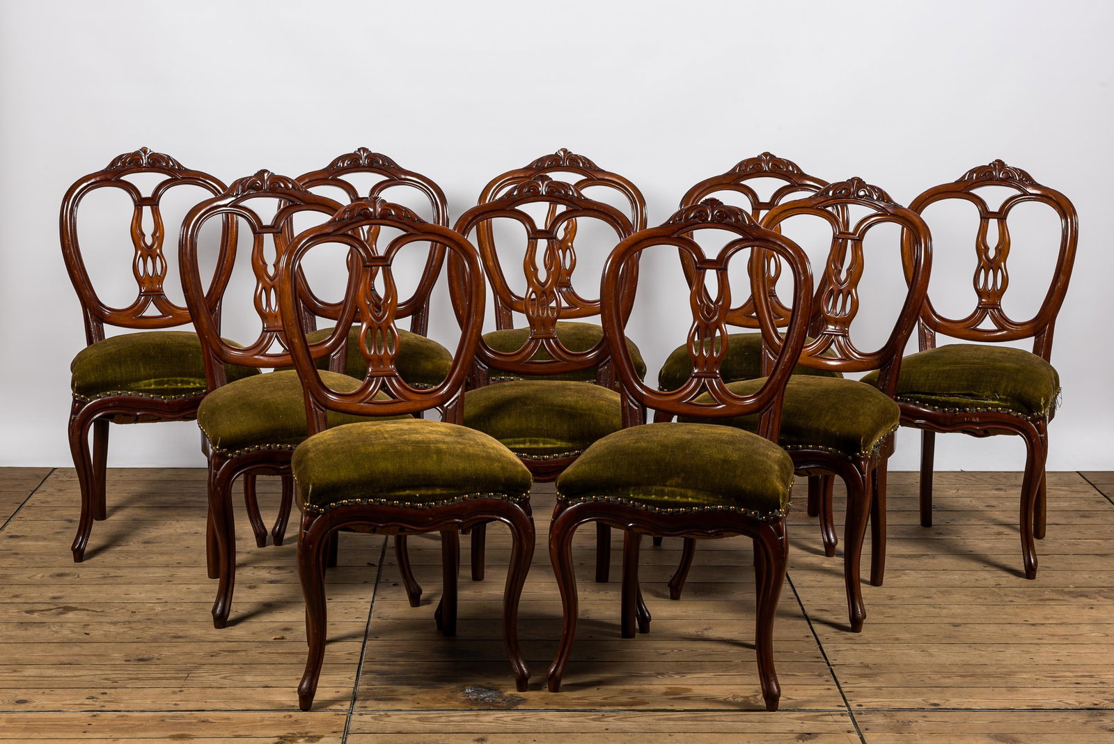A set of ten French wooden chairs with green velvet upholstery, 19th C. (1 of 3)