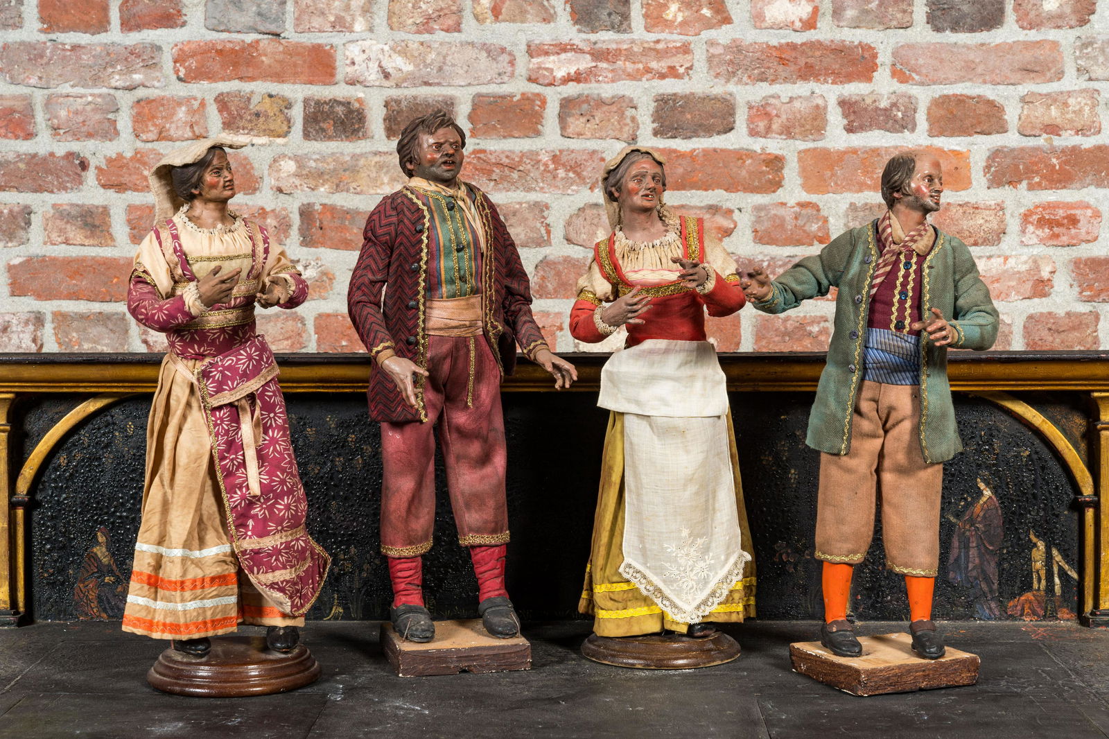 Two pairs of Italian polychrome wooden and terracotta figures in traditional costume, Napoli, 19th (1 of 3)