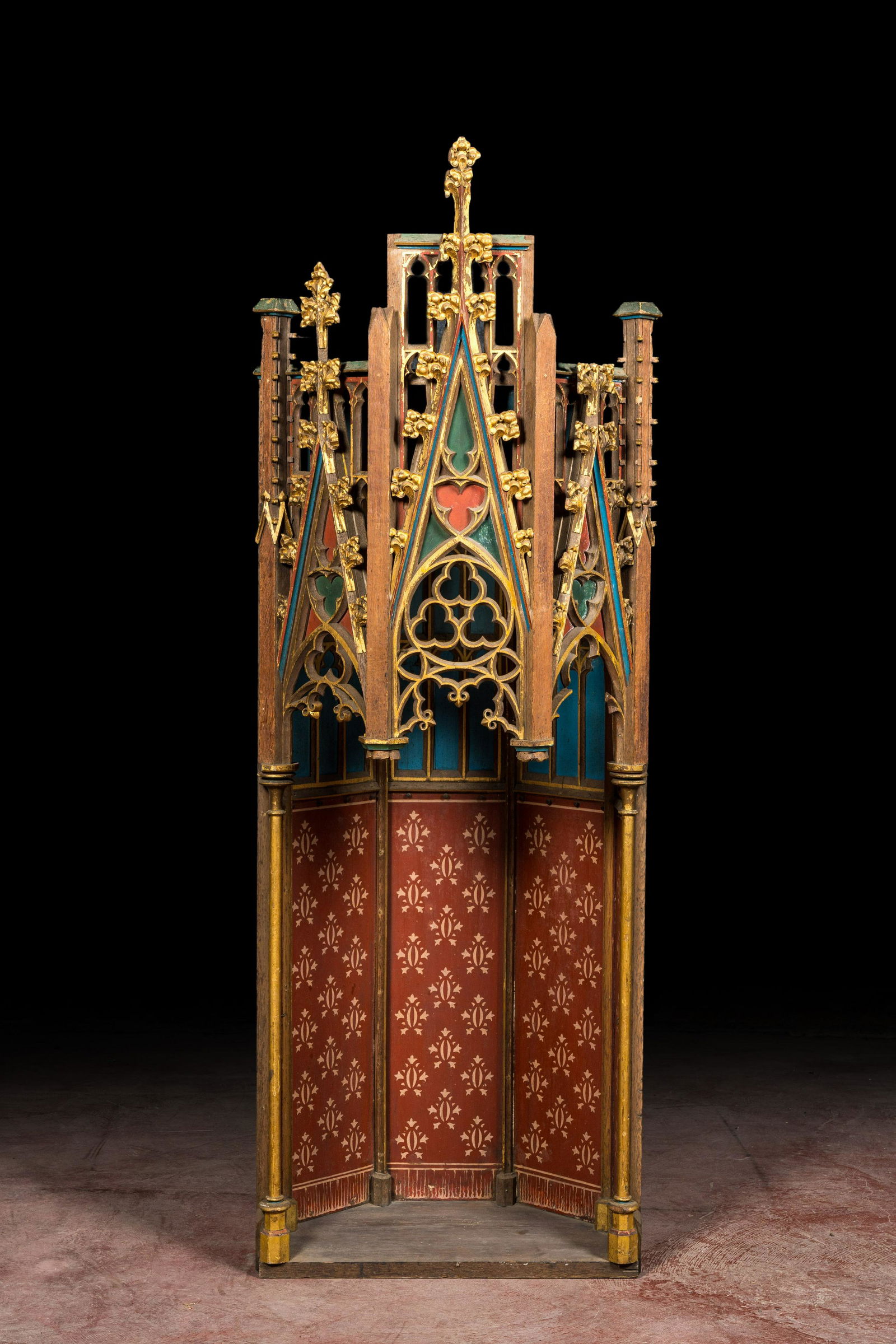 A French Gothic Revival polychromed and gilt wooden canopy, 19th C. (1 of 3)