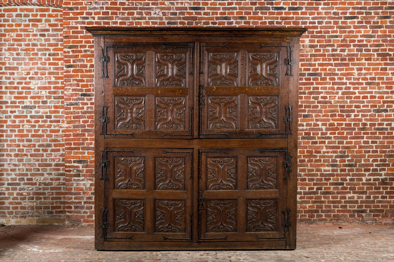 A rare large Flemish oak four-door cupboard with carved X-panels and wrought iron mounts, 1st half (1 of 5)