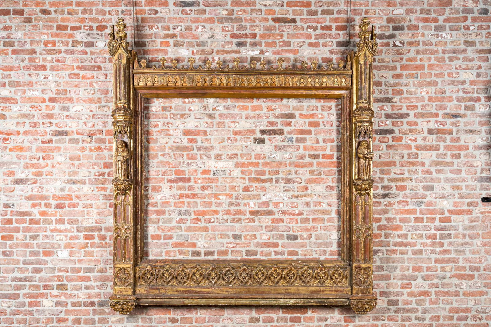 An impressive Gothic Revival carved and gilt wood frame with monks under canopies, 19th C. (1 of 4)