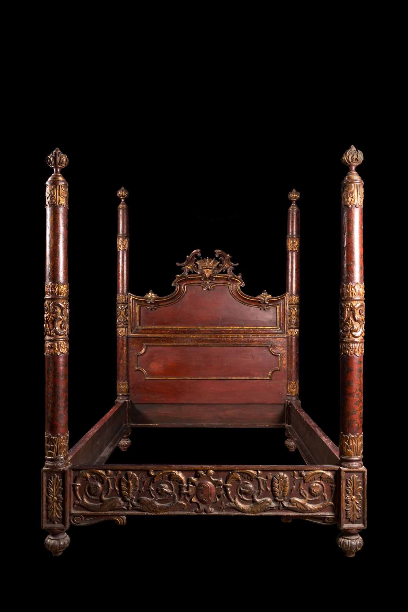 A crowned, painted and gilt carved wooden bed, 19th C. (1 of 5)