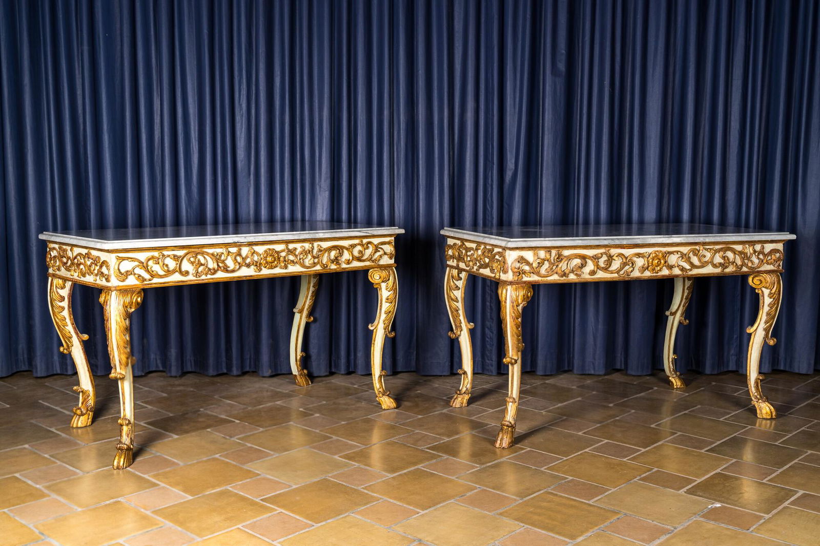 A pair of Italian patinated and gilt wooden wall consoles with marble top, 18th C. (1 of 4)