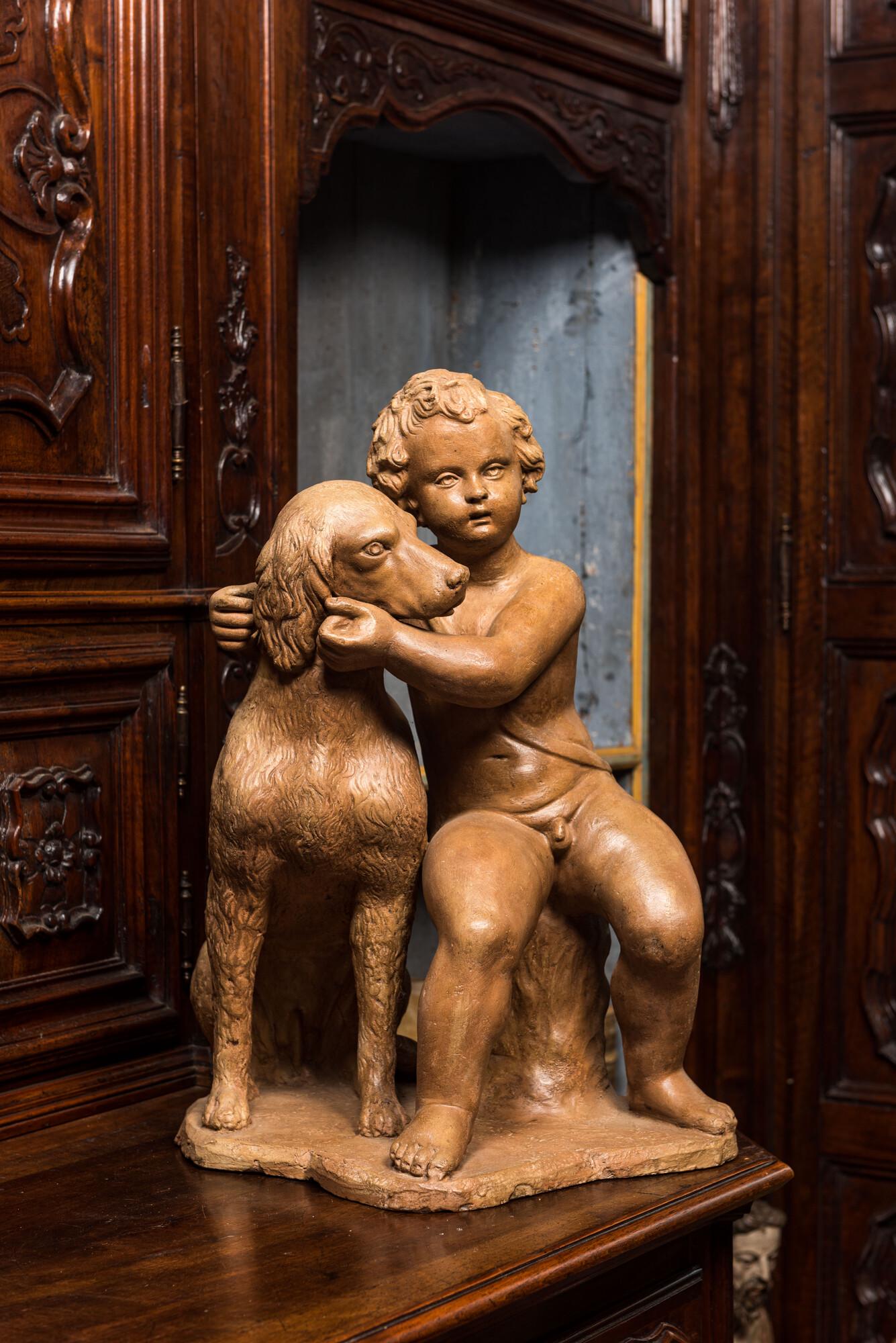 A terracotta group with a putto near a dog, 19th C. (1 of 2)