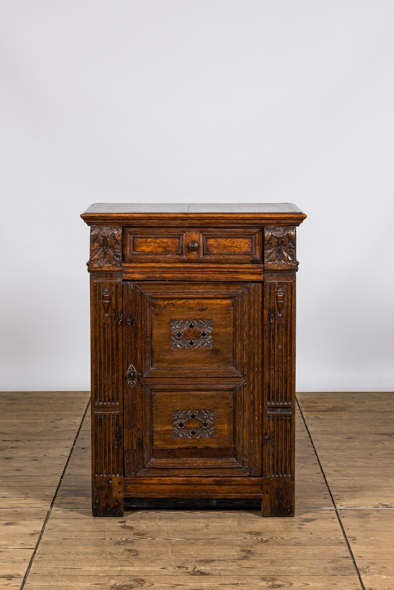 A Renaissance-style oak wooden one-door cabinet, 17th C. (1 of 3)