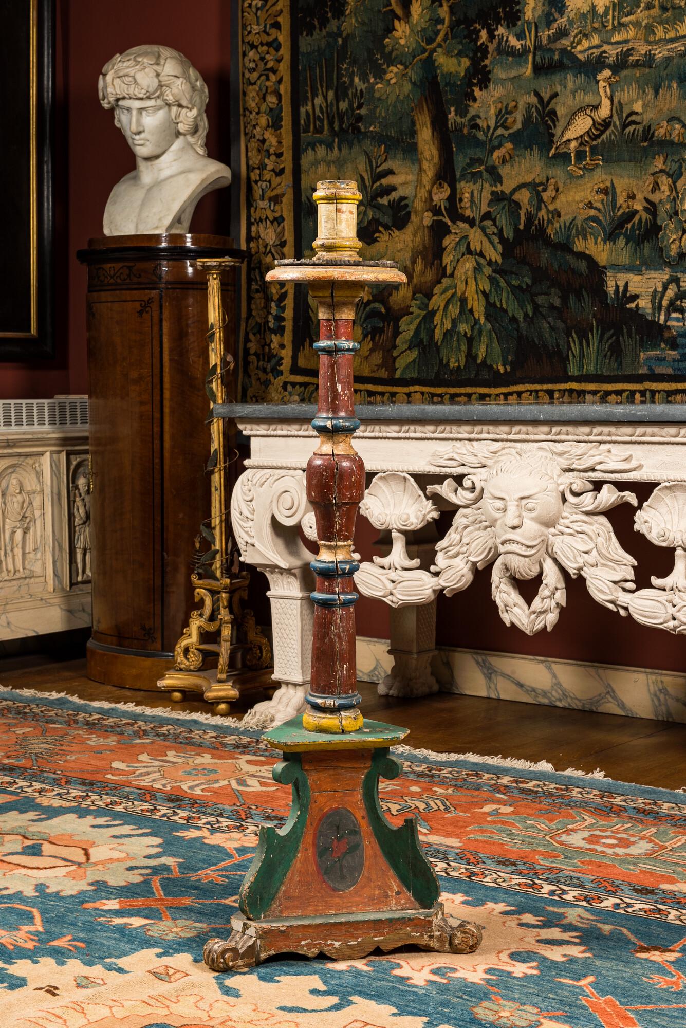 A large polychromed wooden candlestick, probably Italy, 19th C. (1 of 2)