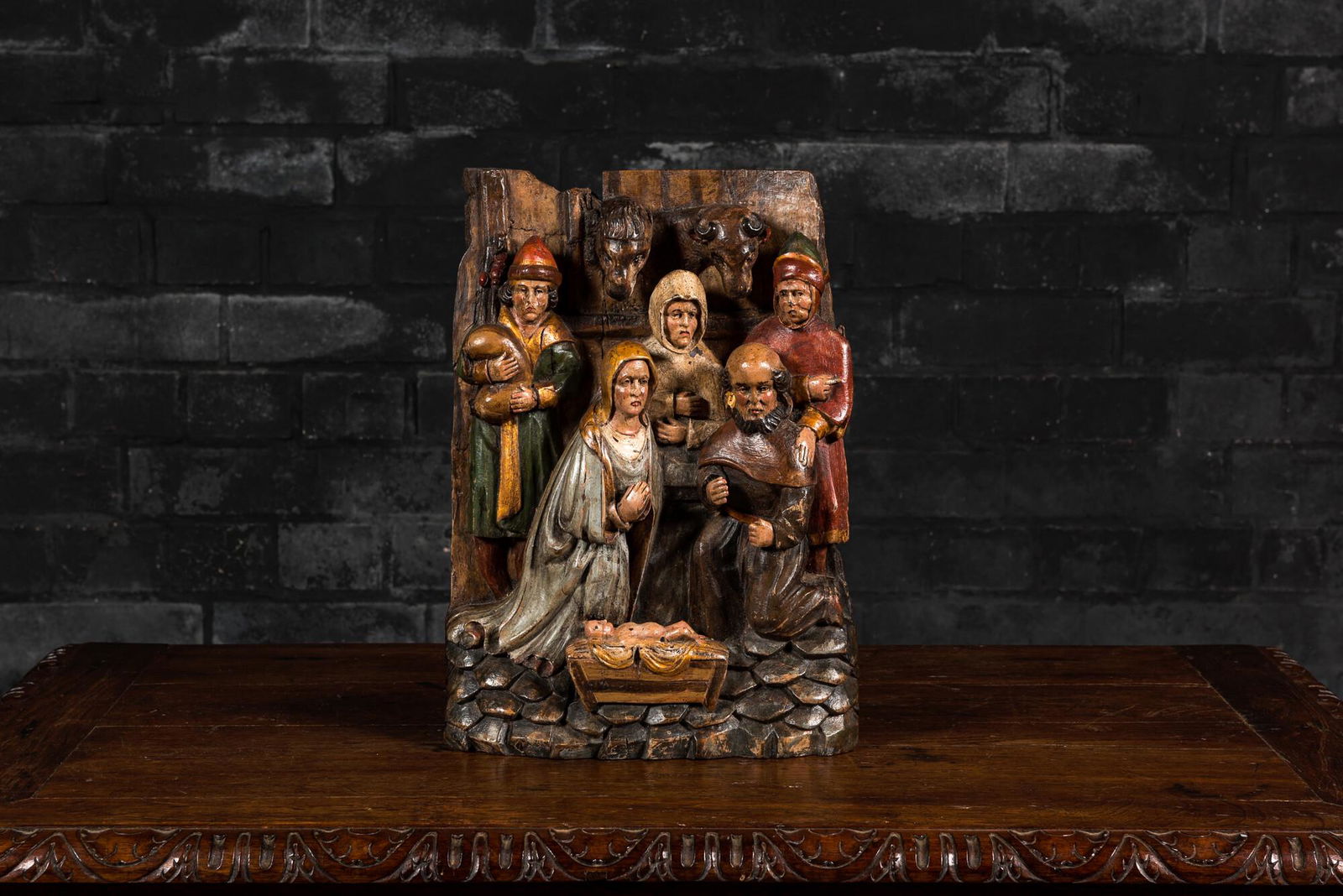A polychromed oak group depicting the adoration of the shepherds, 19th C. (1 of 4)